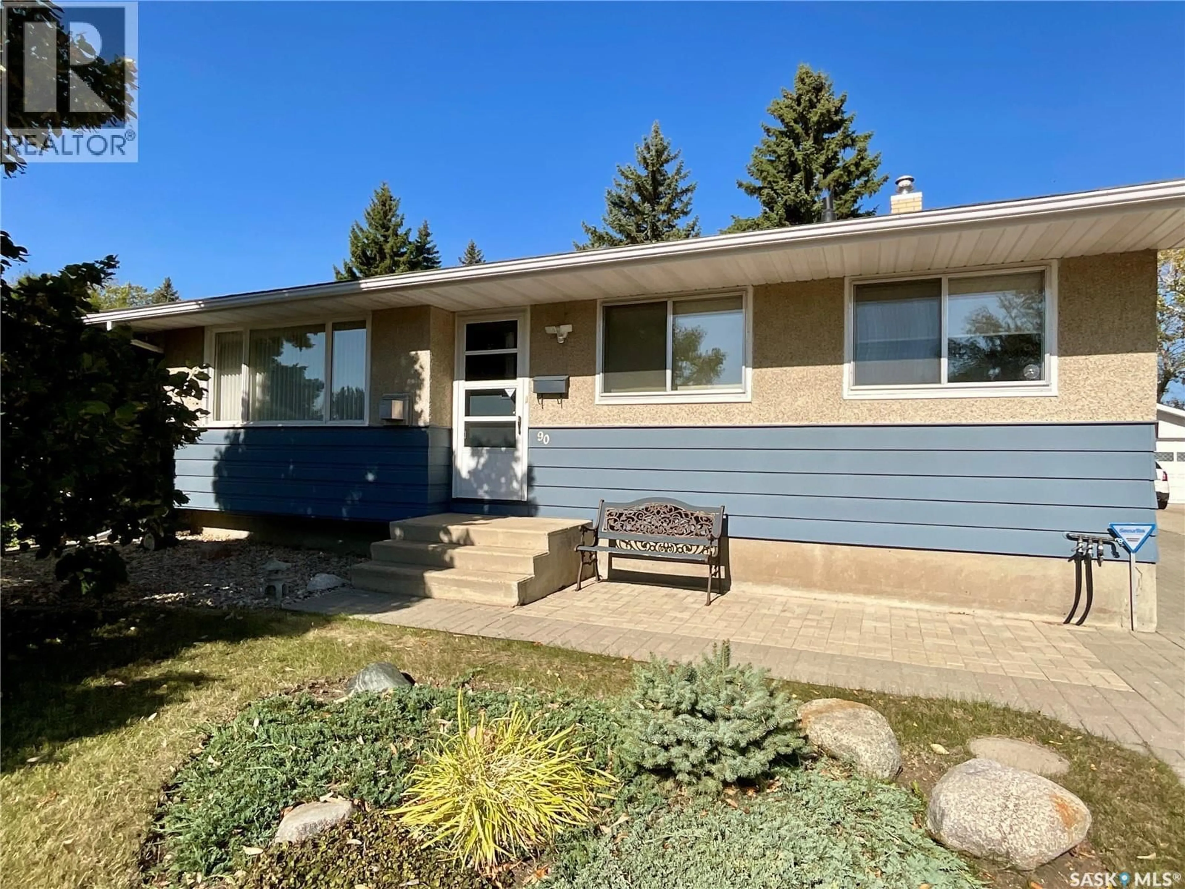 Home with vinyl exterior material, street for 90 HAMMOND ROAD, Regina Saskatchewan S4R3C6