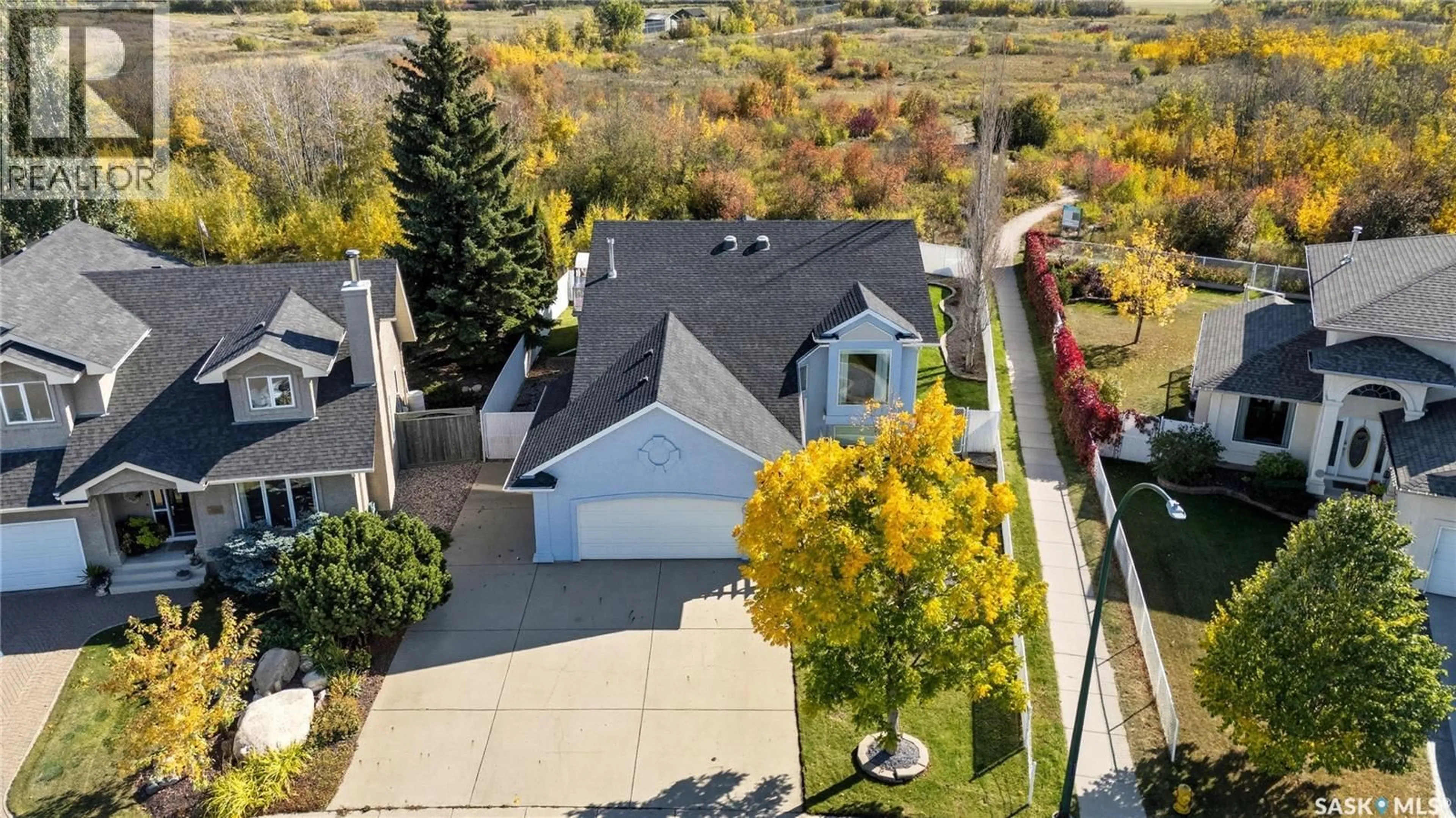 A pic from outside/outdoor area/front of a property/back of a property/a pic from drone, street for 422 LE MAY CRESCENT, Saskatoon Saskatchewan S7S1L1