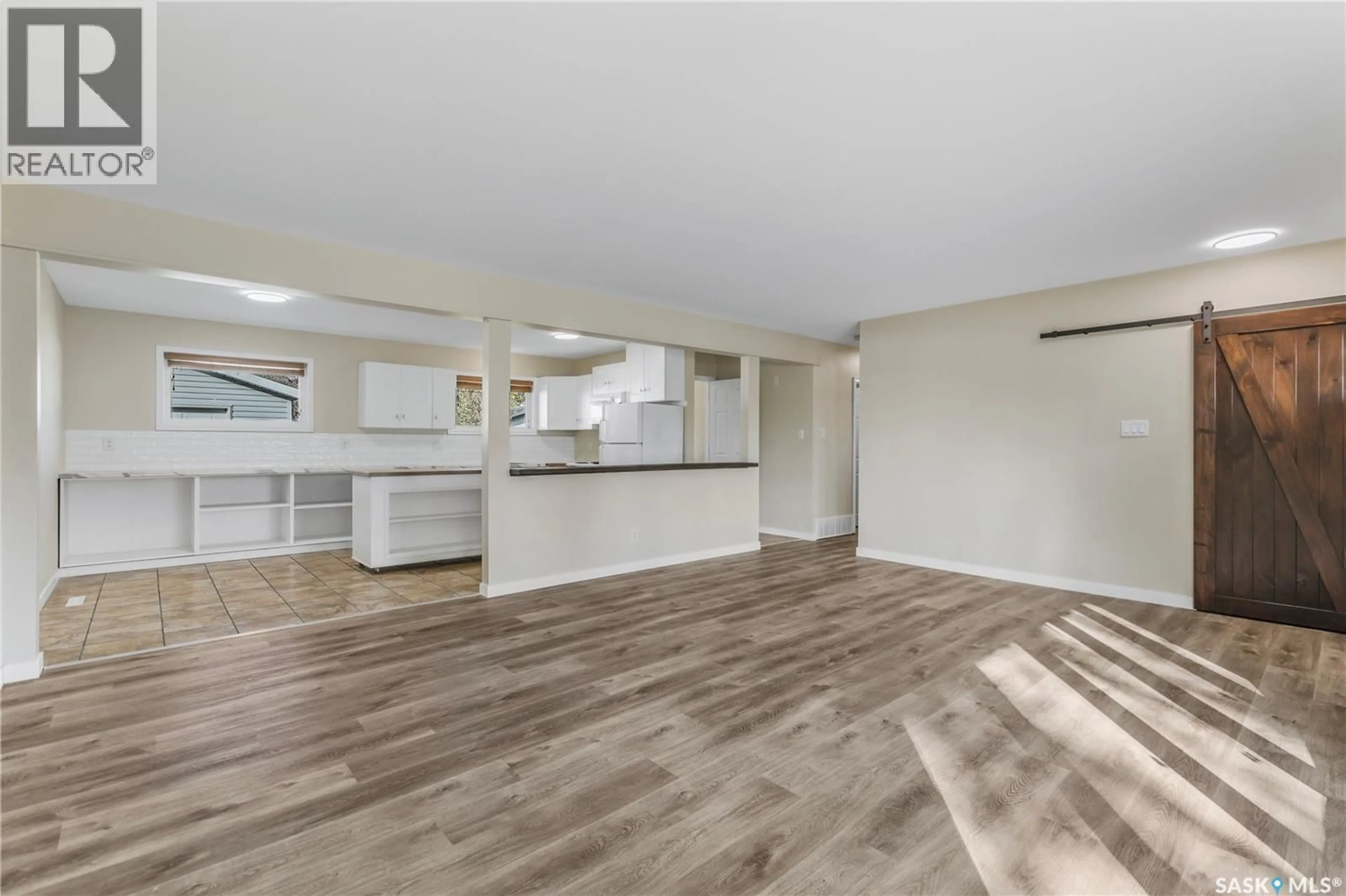 Open concept kitchen, wood/laminate floor for 3802 25TH AVENUE, Regina Saskatchewan S4S1L9