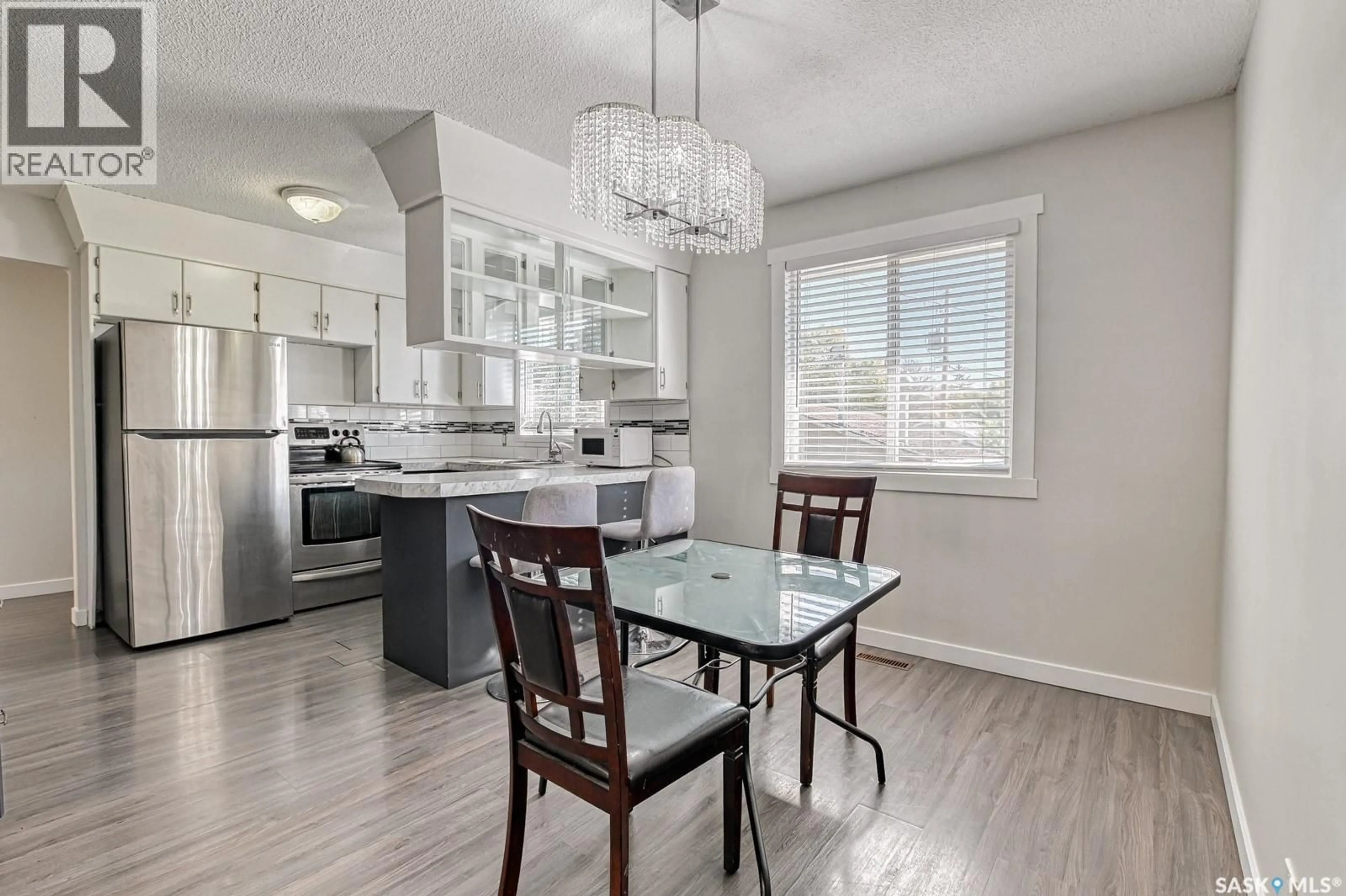 Open concept kitchen, wood/laminate floor for 1443 CLAYTON STREET, Regina Saskatchewan S4T7M8