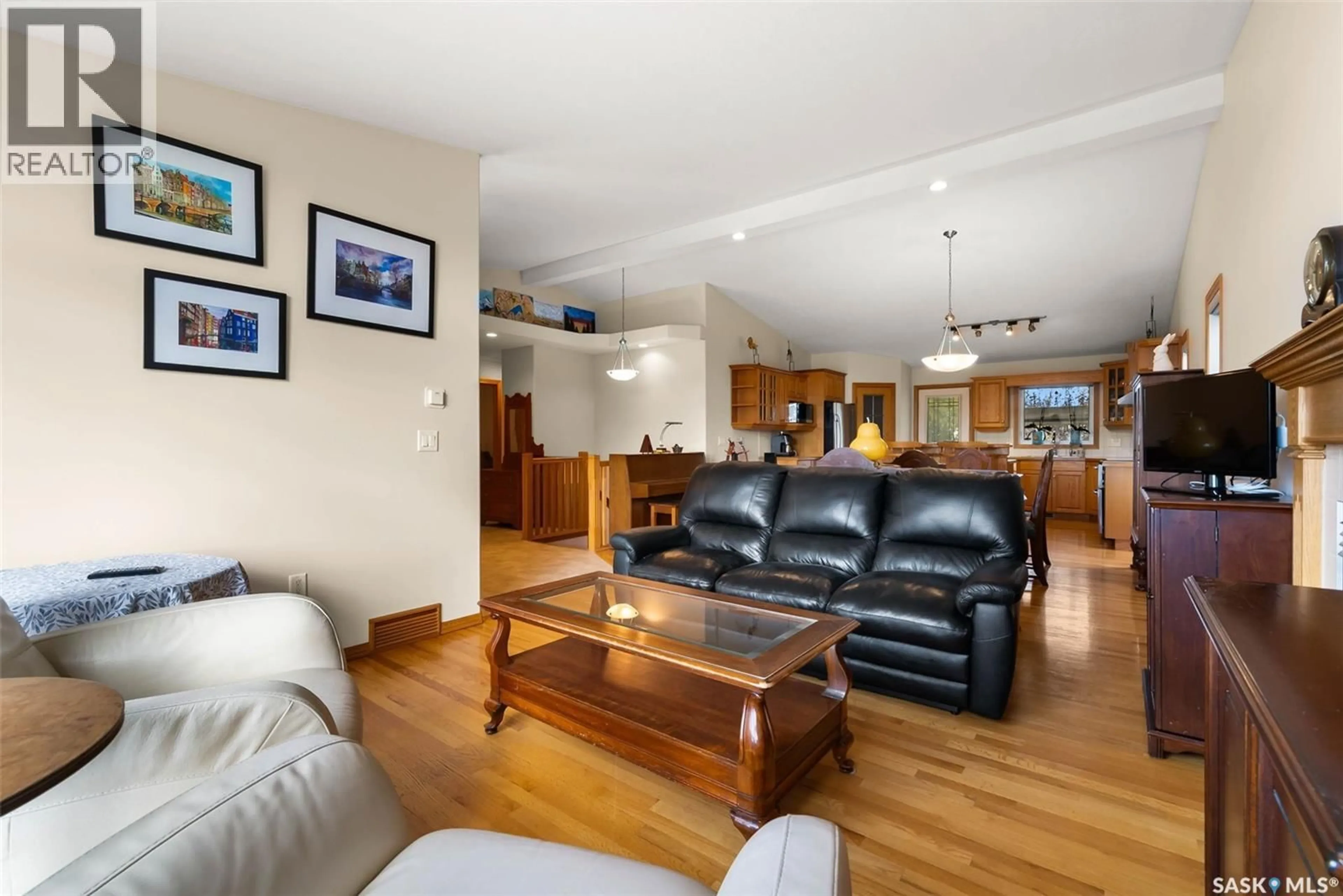 Living room with furniture, wood/laminate floor for 3086 CRANBOURN CRESCENT, Regina Saskatchewan S4V3B3