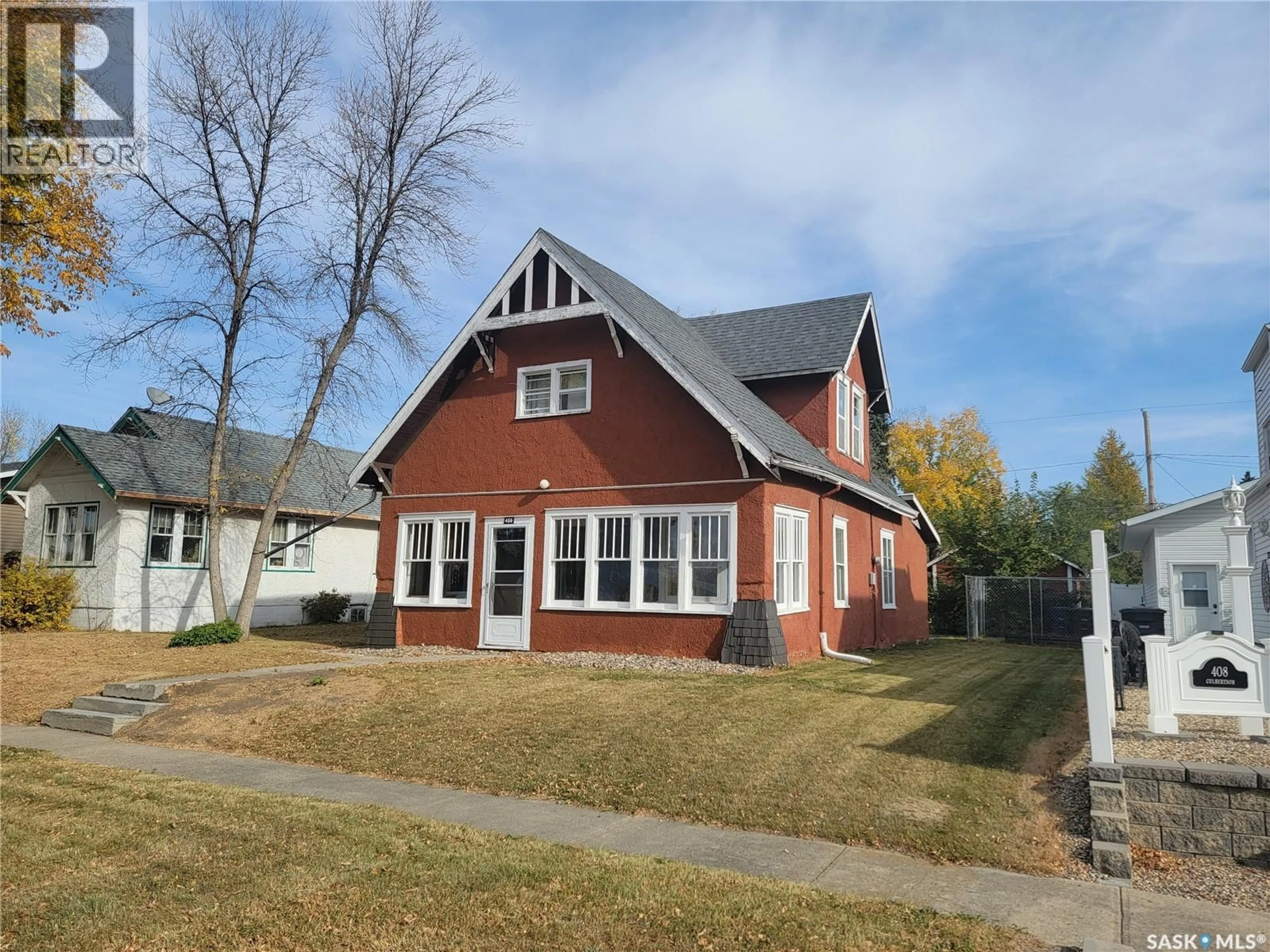 Home with brick exterior material, street for 406 1ST STREET, Wilkie Saskatchewan S0K4W0