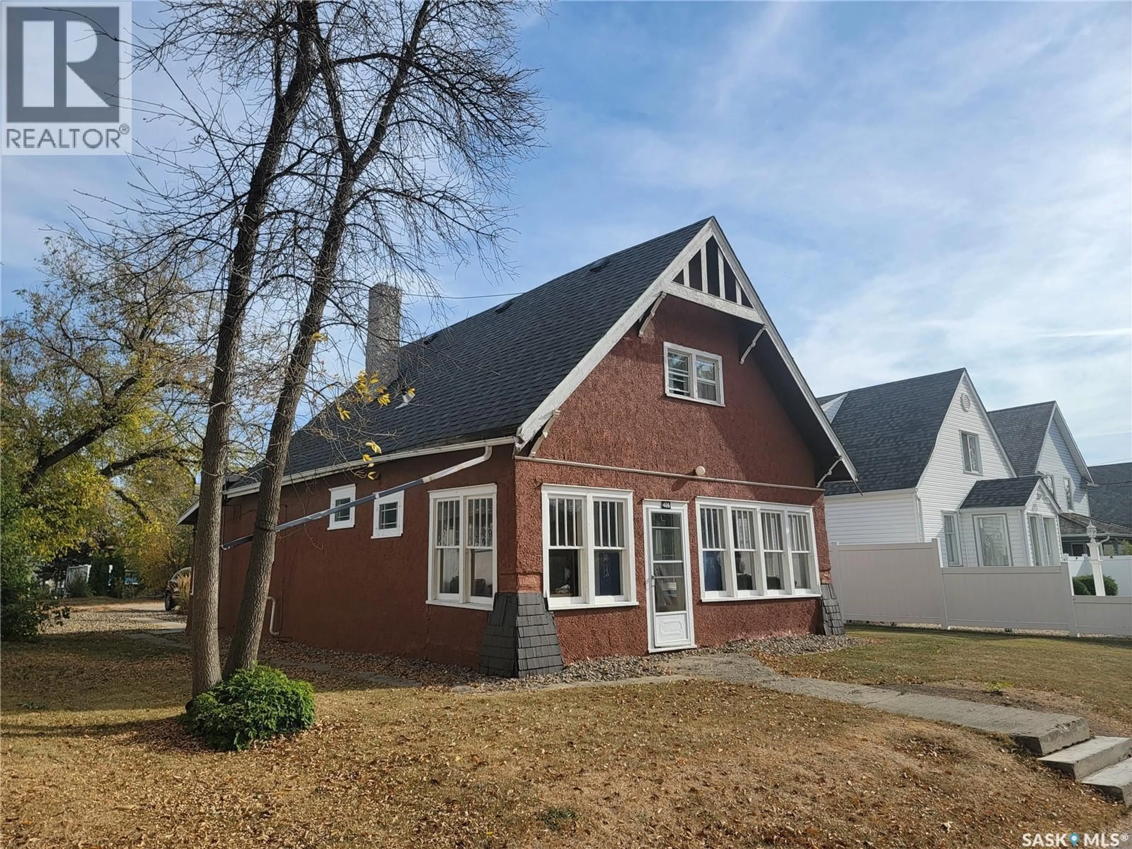 Home with brick exterior material, street for 406 1ST STREET, Wilkie Saskatchewan S0K4W0