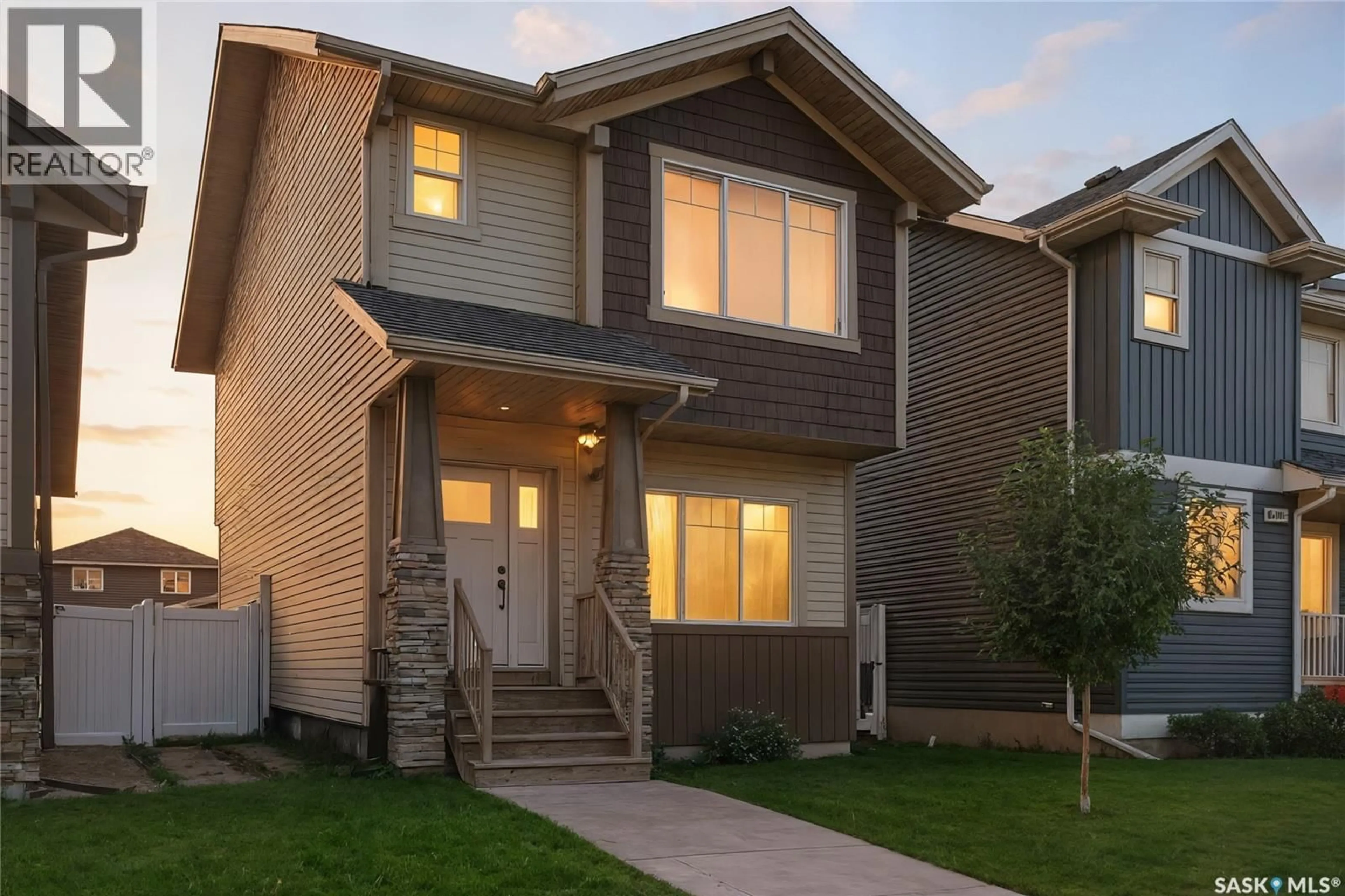 Home with brick exterior material, street for 966 MCFAULL MANOR, Saskatoon Saskatchewan S7V0S6