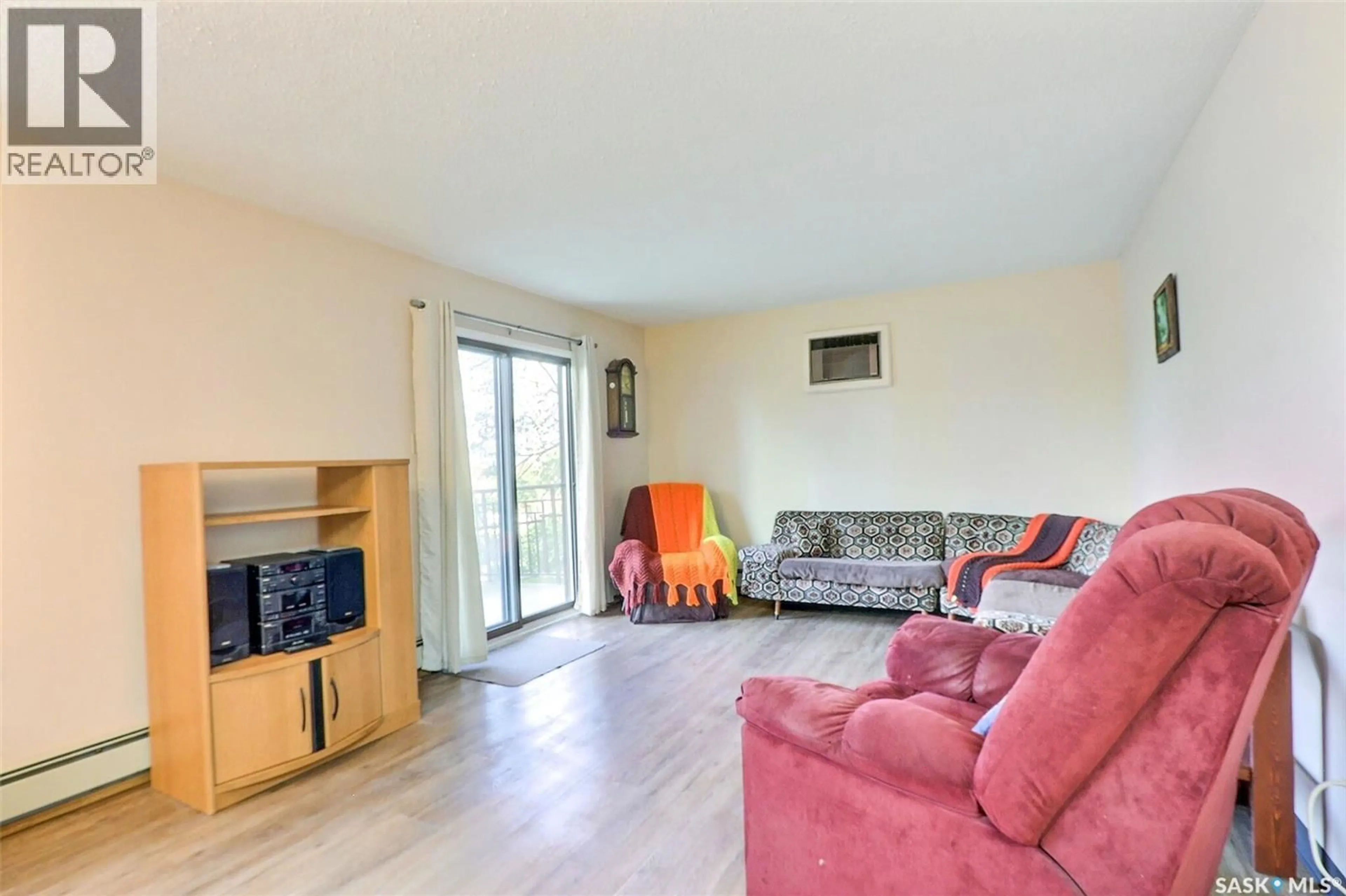 Living room with furniture, wood/laminate floor for 102 54 19TH STREET E, Prince Albert Saskatchewan S6V1J2