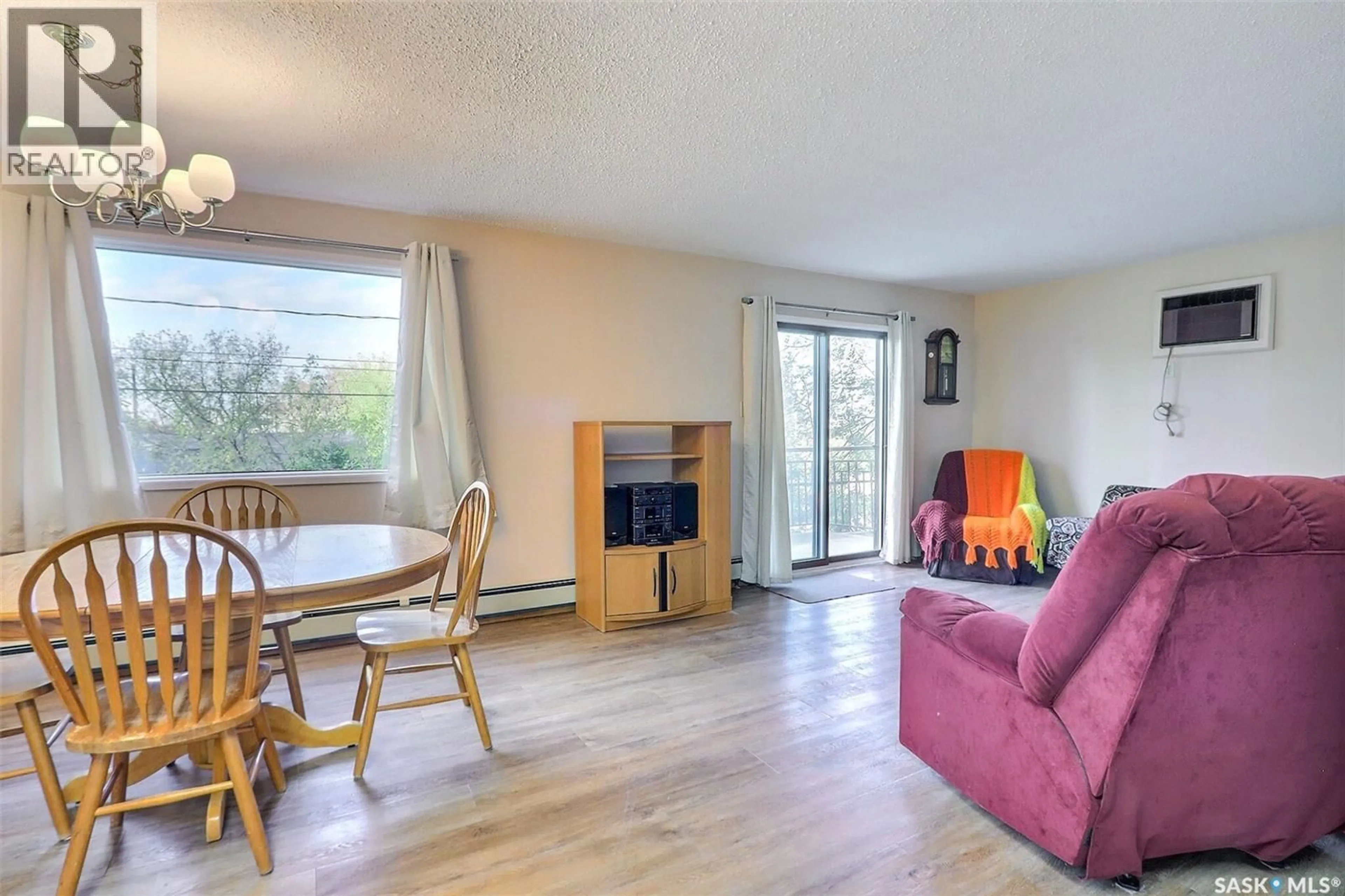 Living room with furniture, wood/laminate floor for 102 54 19TH STREET E, Prince Albert Saskatchewan S6V1J2