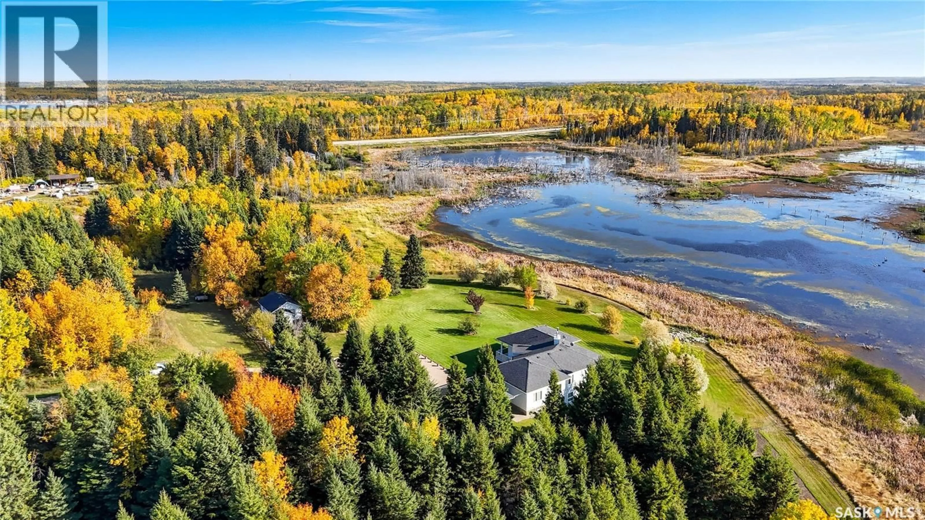 A pic from outside/outdoor area/front of a property/back of a property/a pic from drone, water/lake/river/ocean view for 119 ASPEN CRESCENT, Christopher Lake Saskatchewan S0J0N0