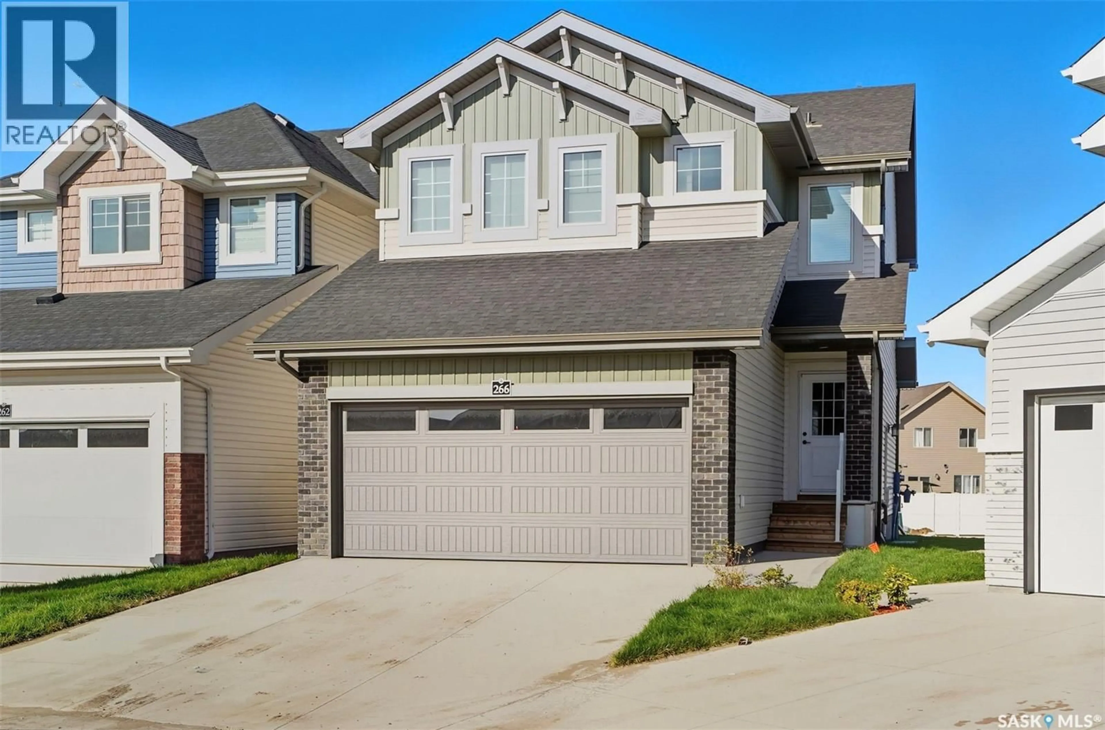 Home with vinyl exterior material, street for 266 SCHMEISER BEND, Saskatoon Saskatchewan S7V1P7