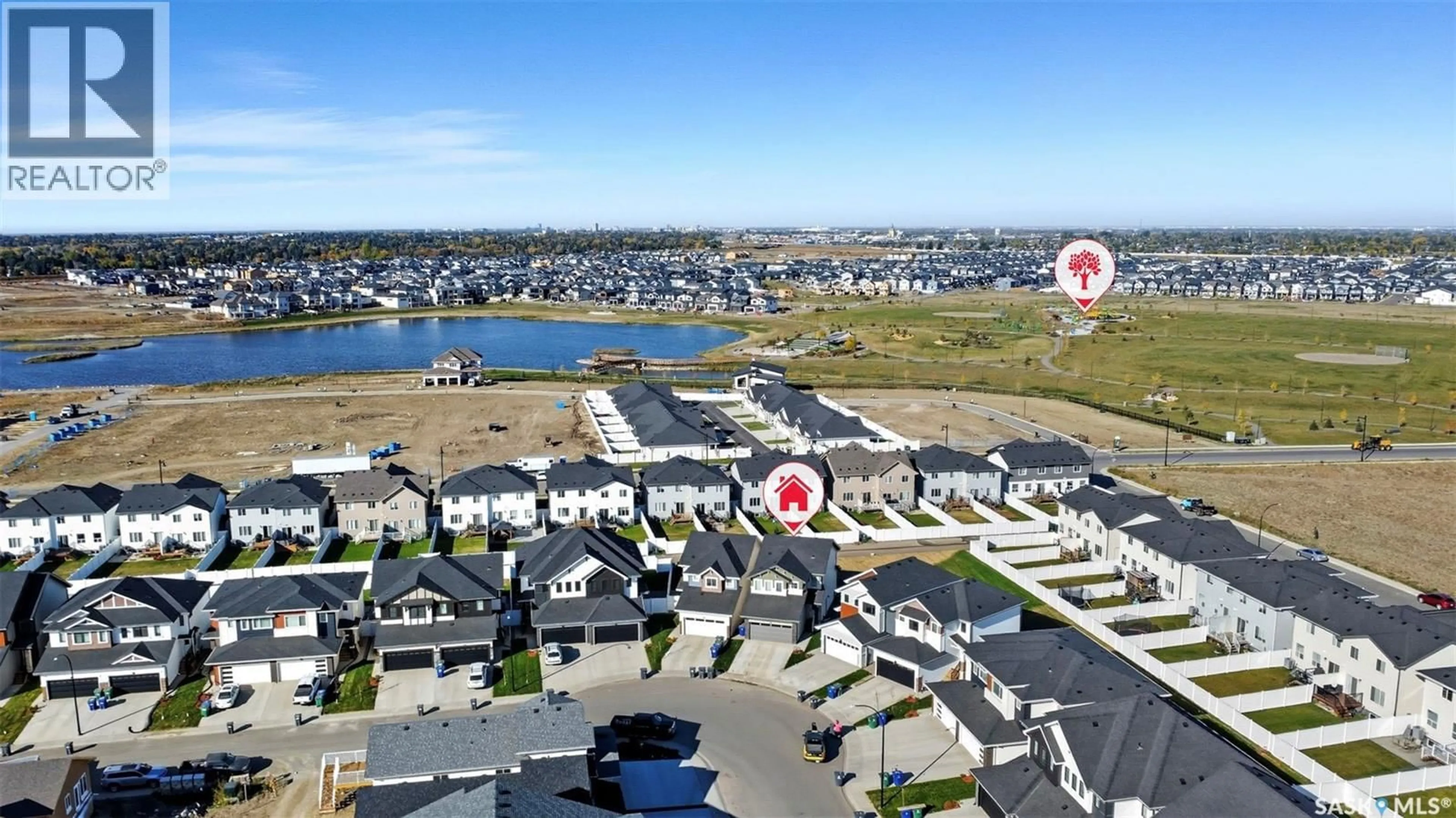 A pic from outside/outdoor area/front of a property/back of a property/a pic from drone, water/lake/river/ocean view for 266 SCHMEISER BEND, Saskatoon Saskatchewan S7V1P7