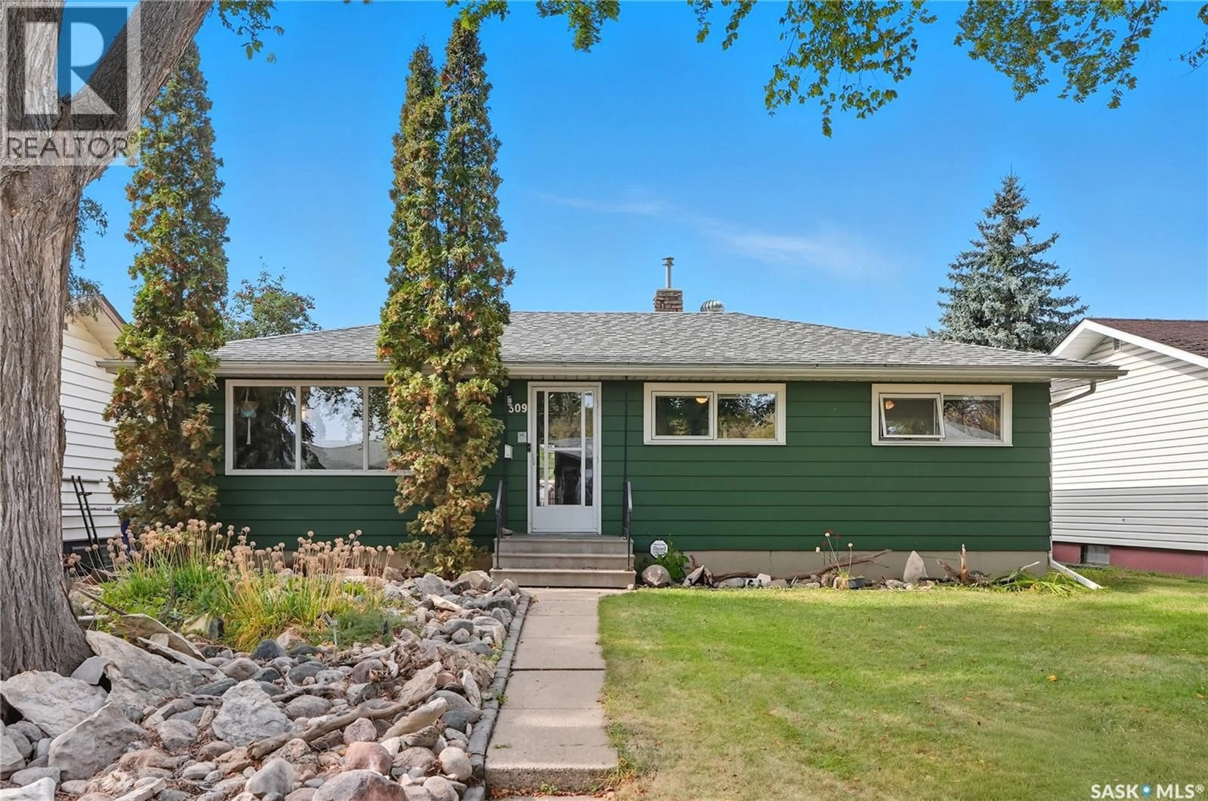 Home with vinyl exterior material, street for 309 X AVENUE, Saskatoon Saskatchewan S7L3J7