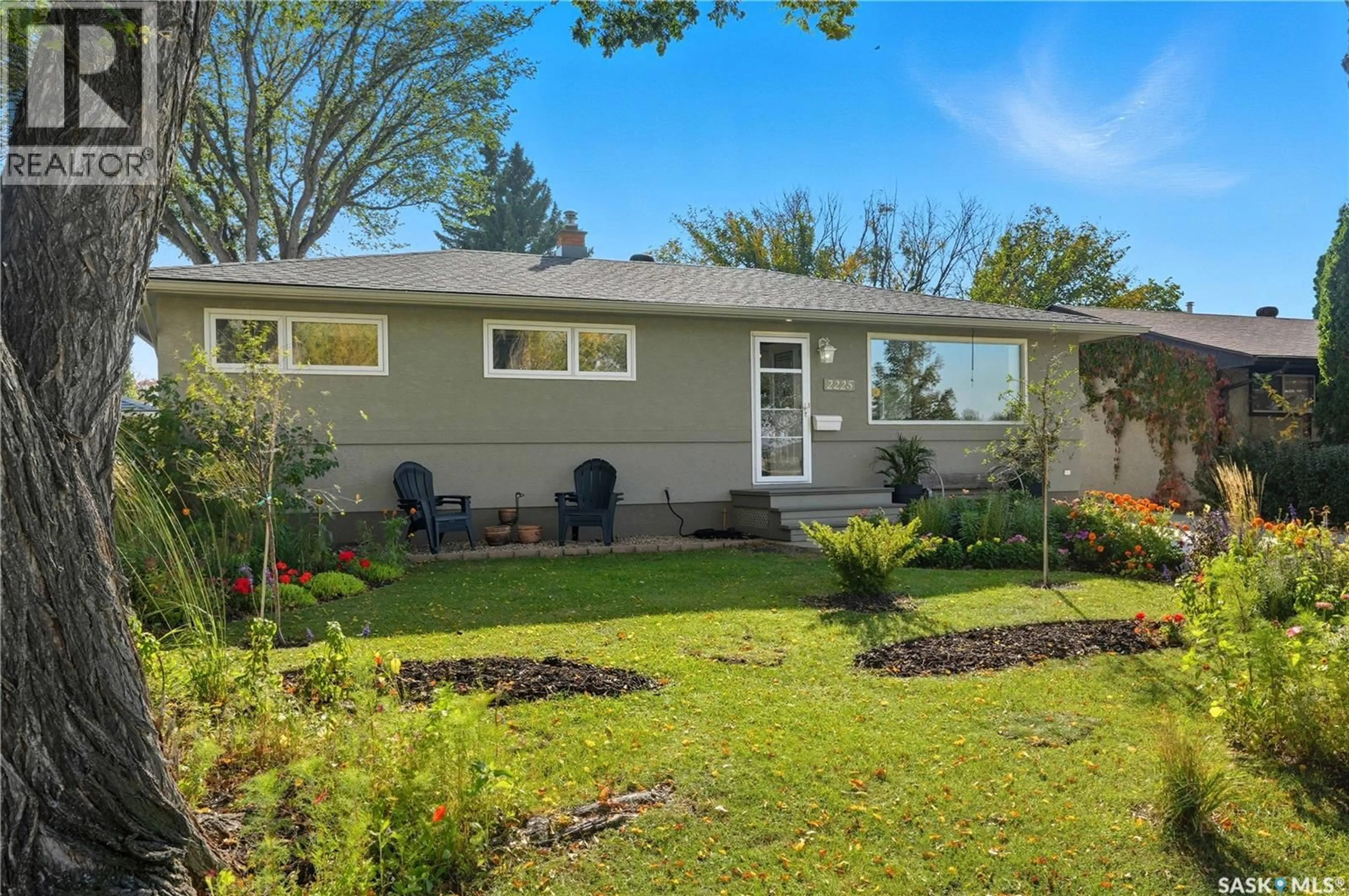 Home with vinyl exterior material, street for 2225 RICHARDSON ROAD, Saskatoon Saskatchewan S7L4B9