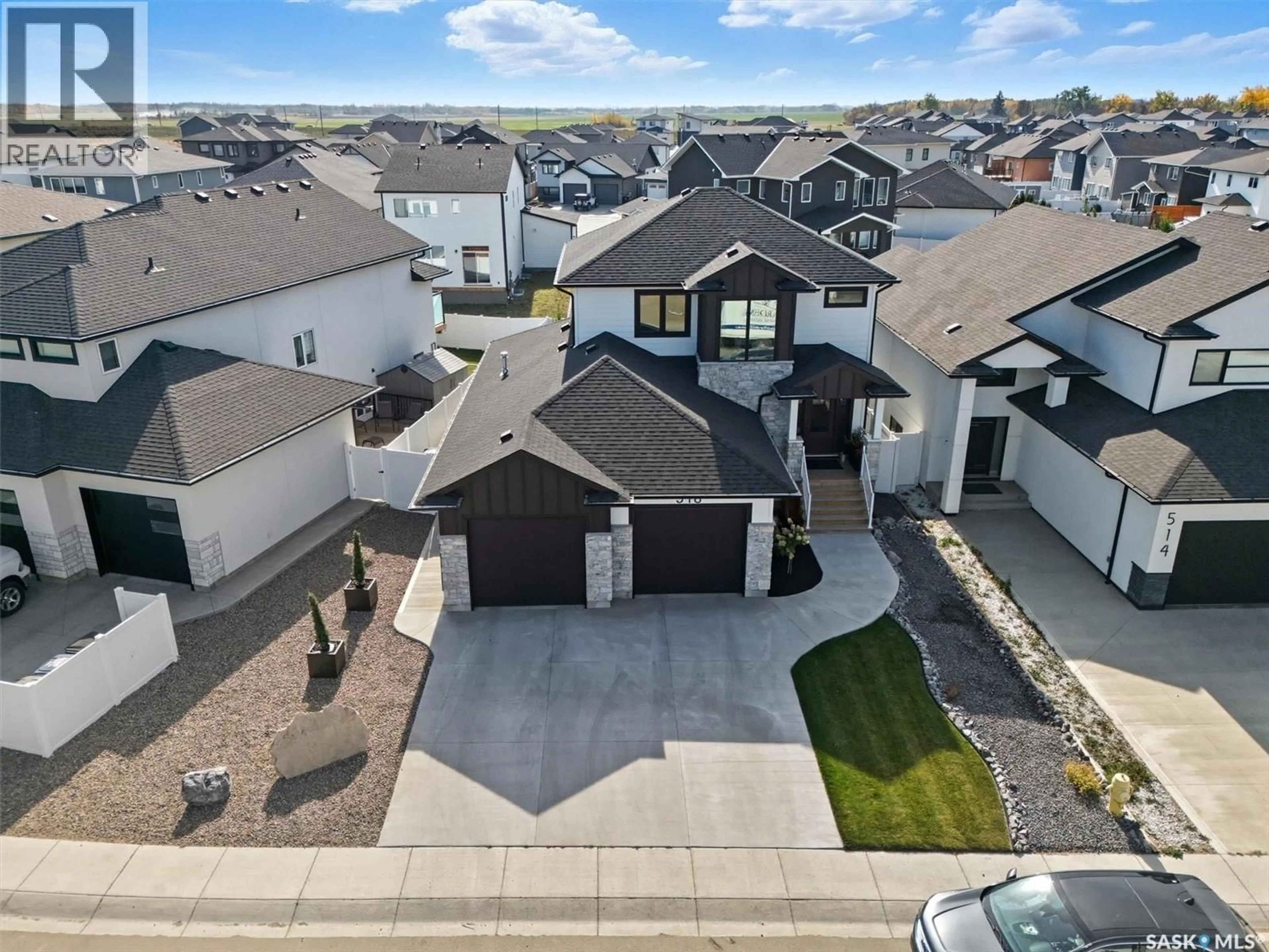 A pic from outside/outdoor area/front of a property/back of a property/a pic from drone, street for 518 HAMM CRESCENT, Saskatoon Saskatchewan S7V0Z2