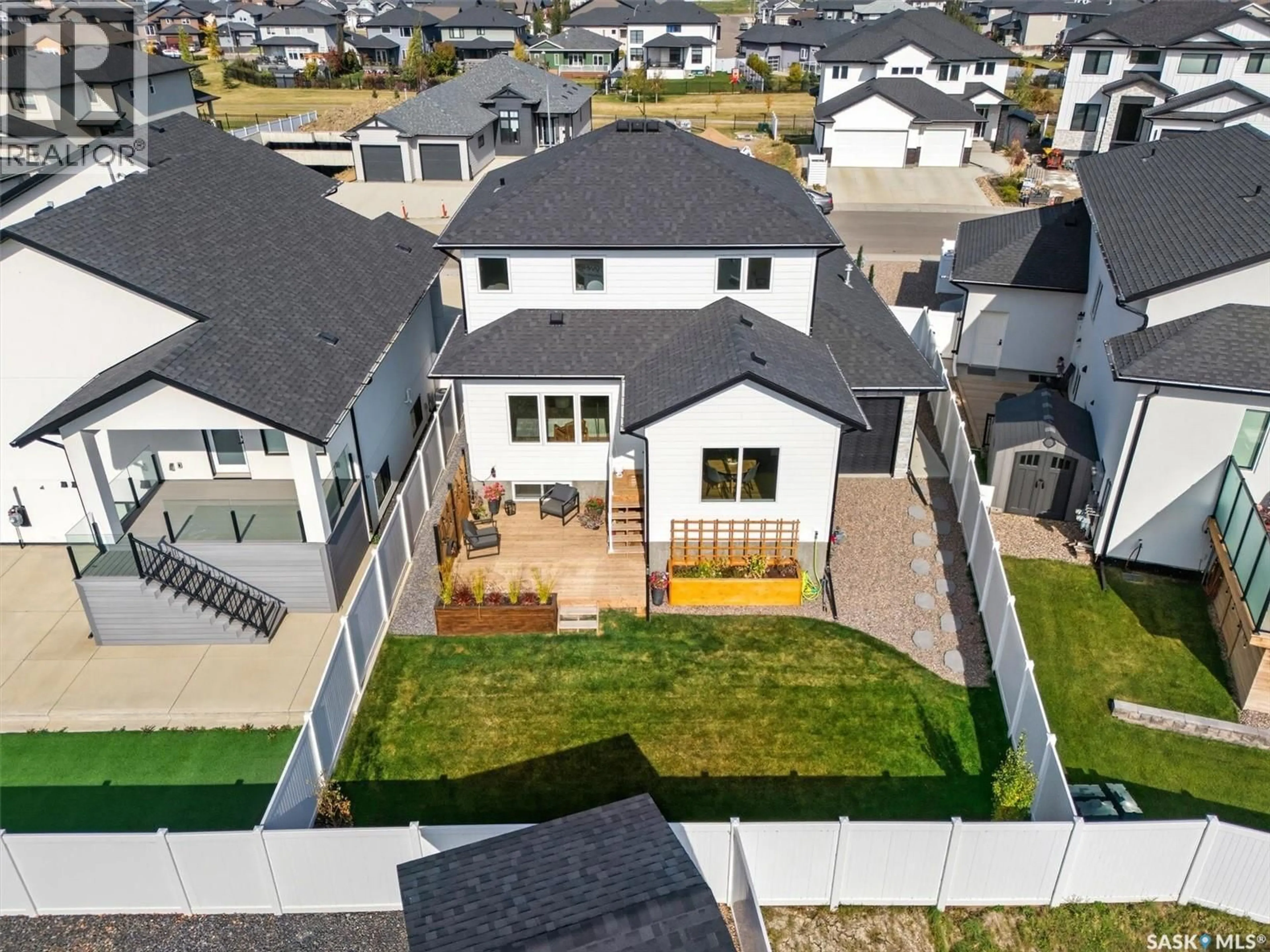 A pic from outside/outdoor area/front of a property/back of a property/a pic from drone, unknown for 518 HAMM CRESCENT, Saskatoon Saskatchewan S7V0Z2
