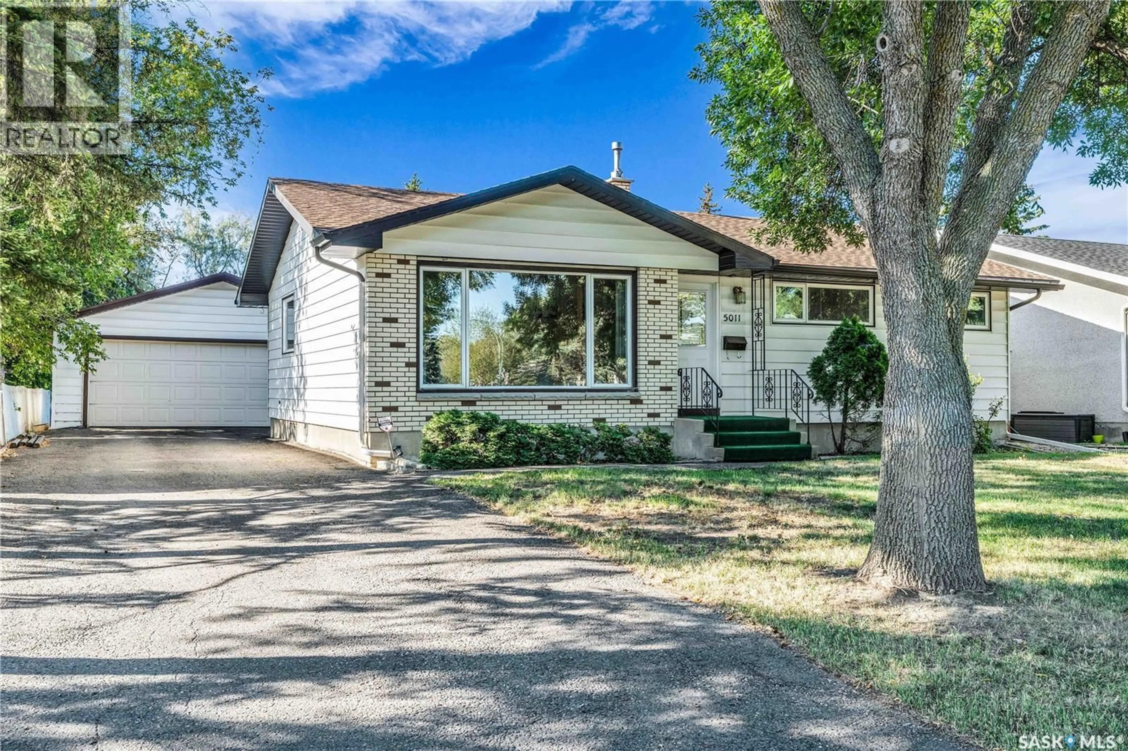Home with vinyl exterior material, street for 5011 7TH AVENUE, Regina Saskatchewan S4R0K5