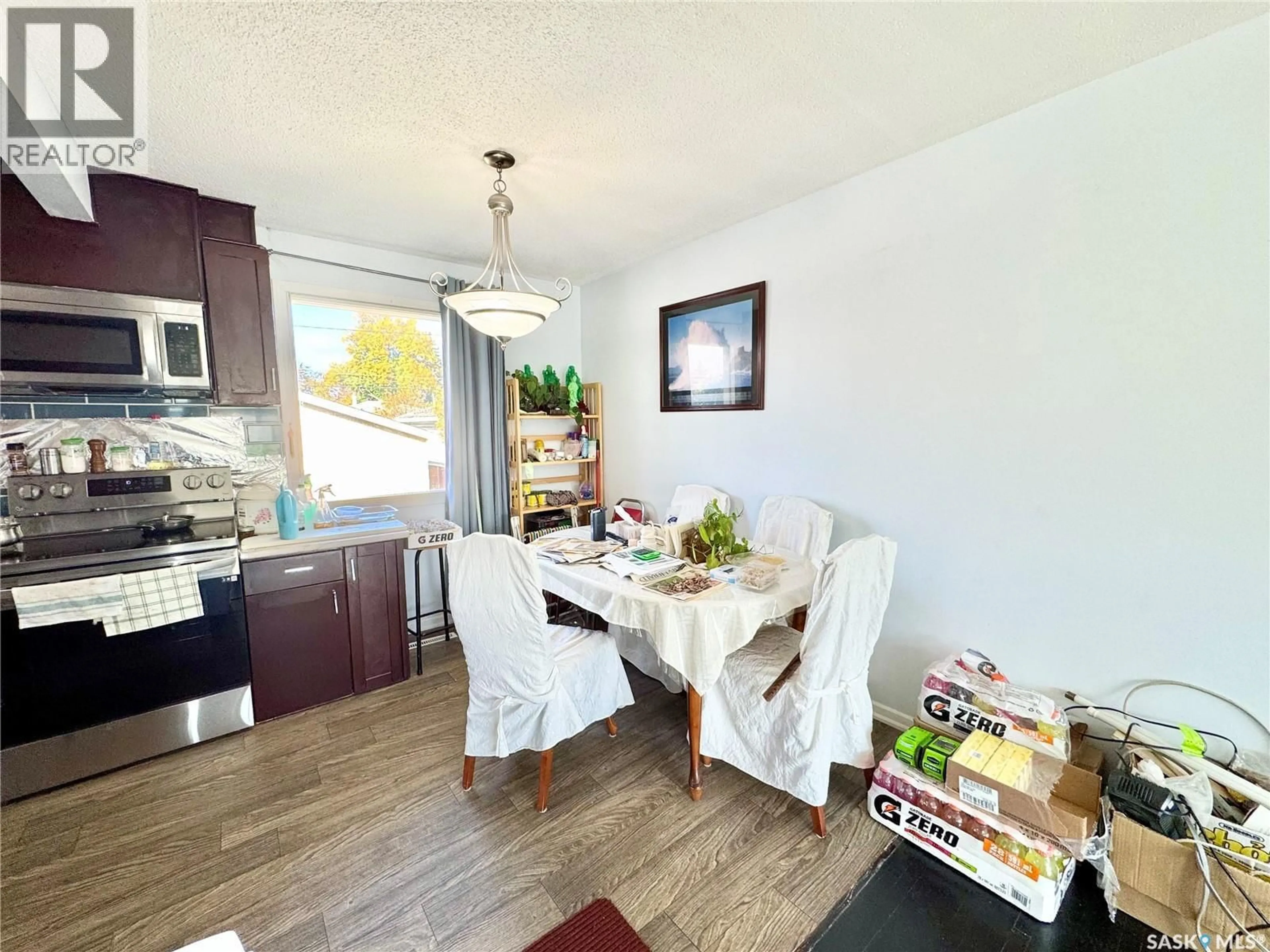 Dining room, wood/laminate floor for 2619 6TH AVENUE, Prince Albert Saskatchewan S6V5L4