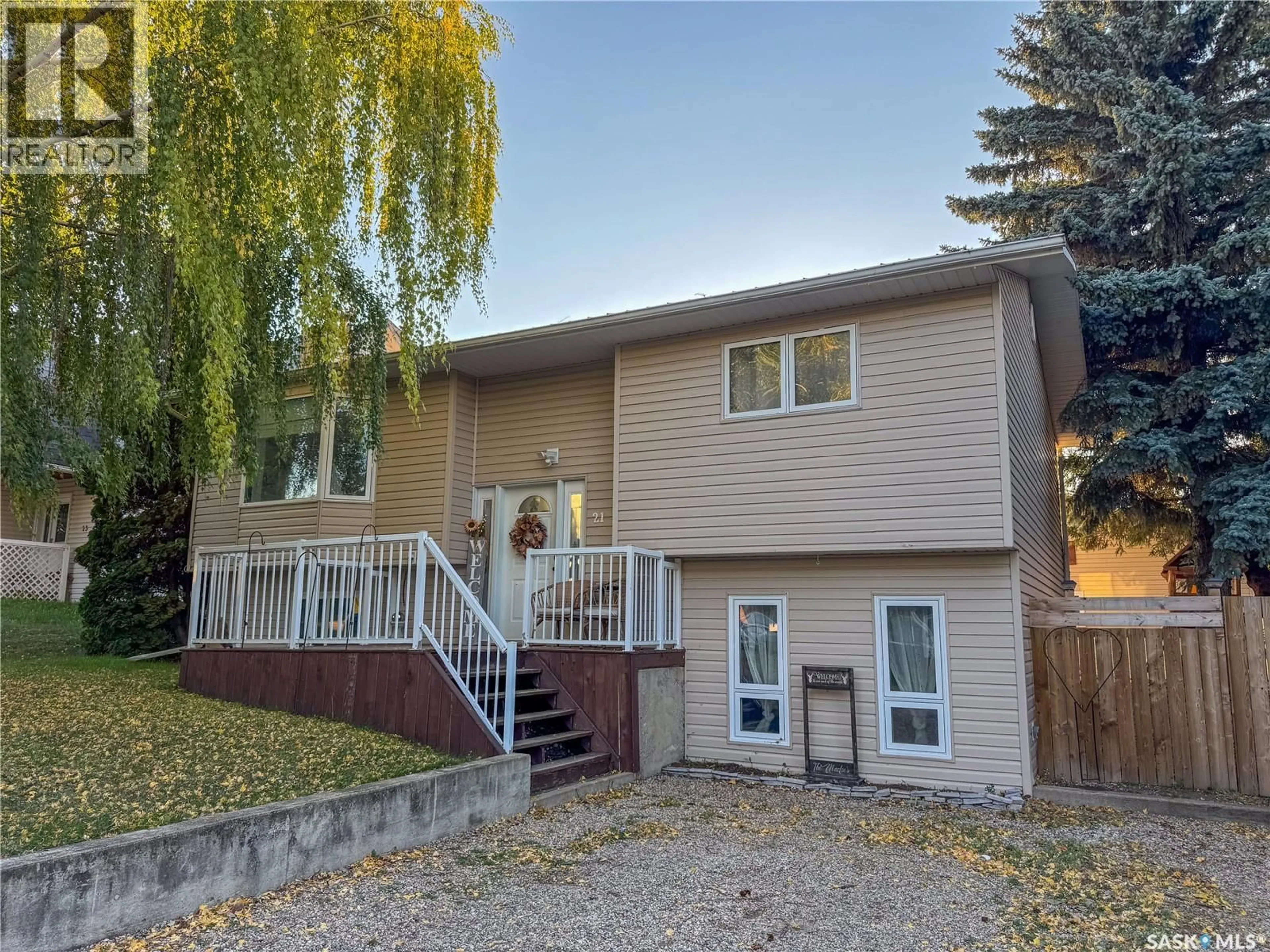 Home with vinyl exterior material, street for 21 MAPLE PLACE, Birch Hills Saskatchewan S0J0G0