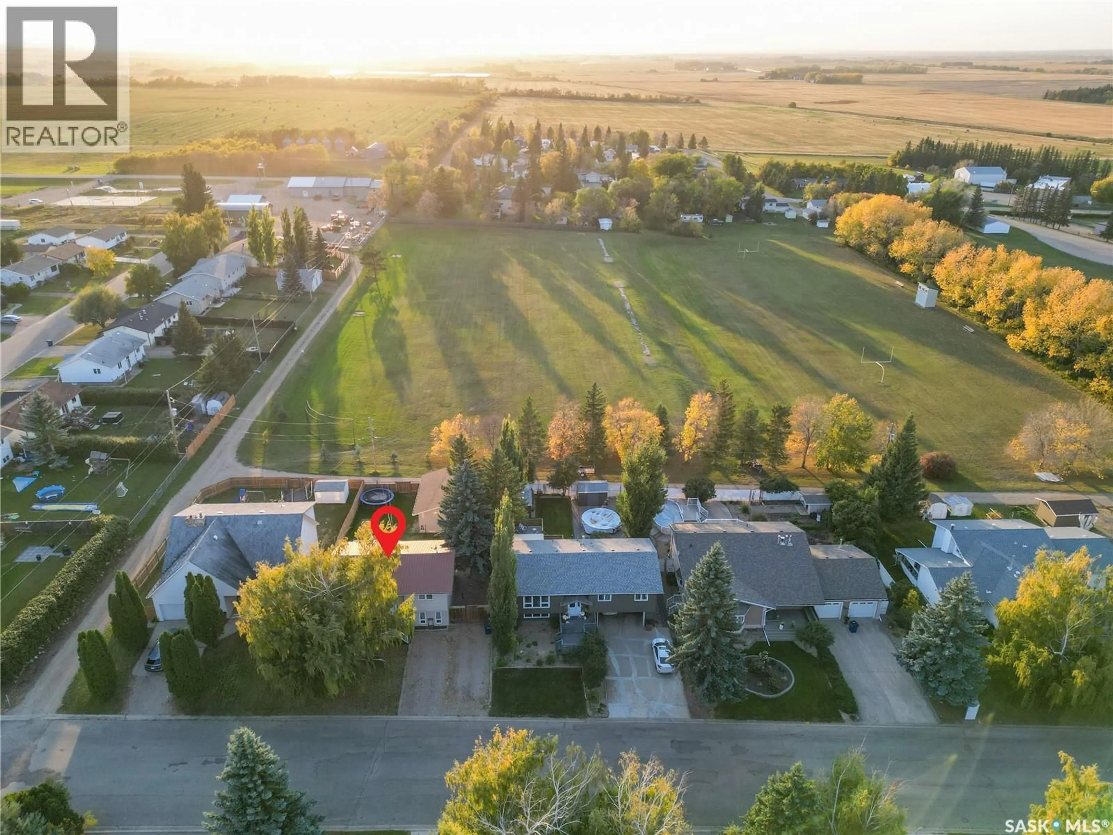 A pic from outside/outdoor area/front of a property/back of a property/a pic from drone, mountain view for 21 MAPLE PLACE, Birch Hills Saskatchewan S0J0G0