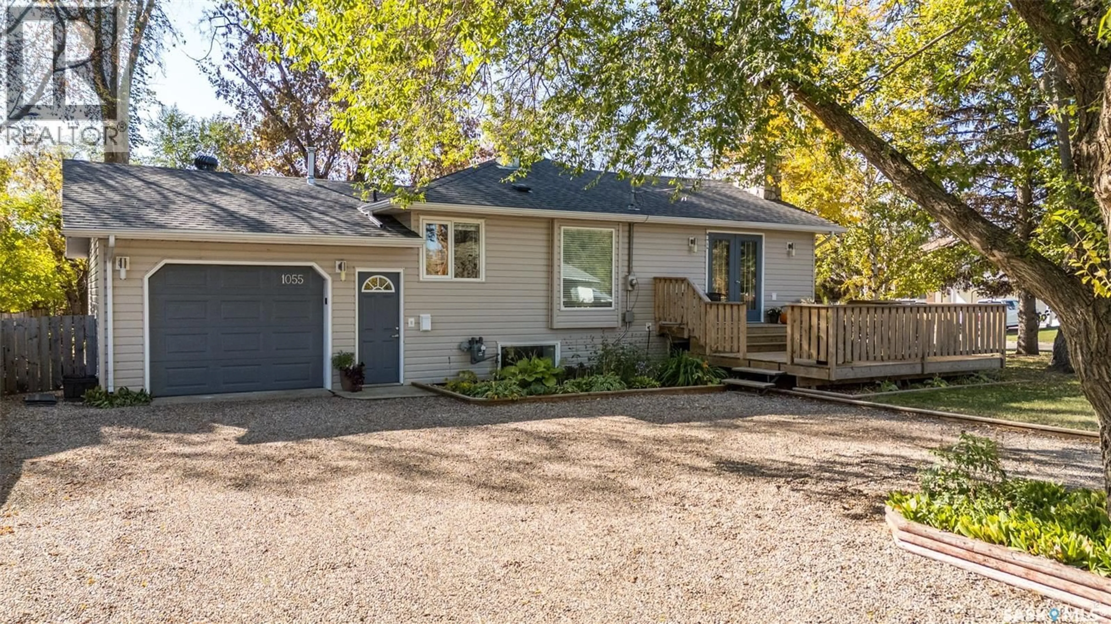 Home with vinyl exterior material, street for 1055 6TH STREET, Prince Albert Saskatchewan S6V0P6