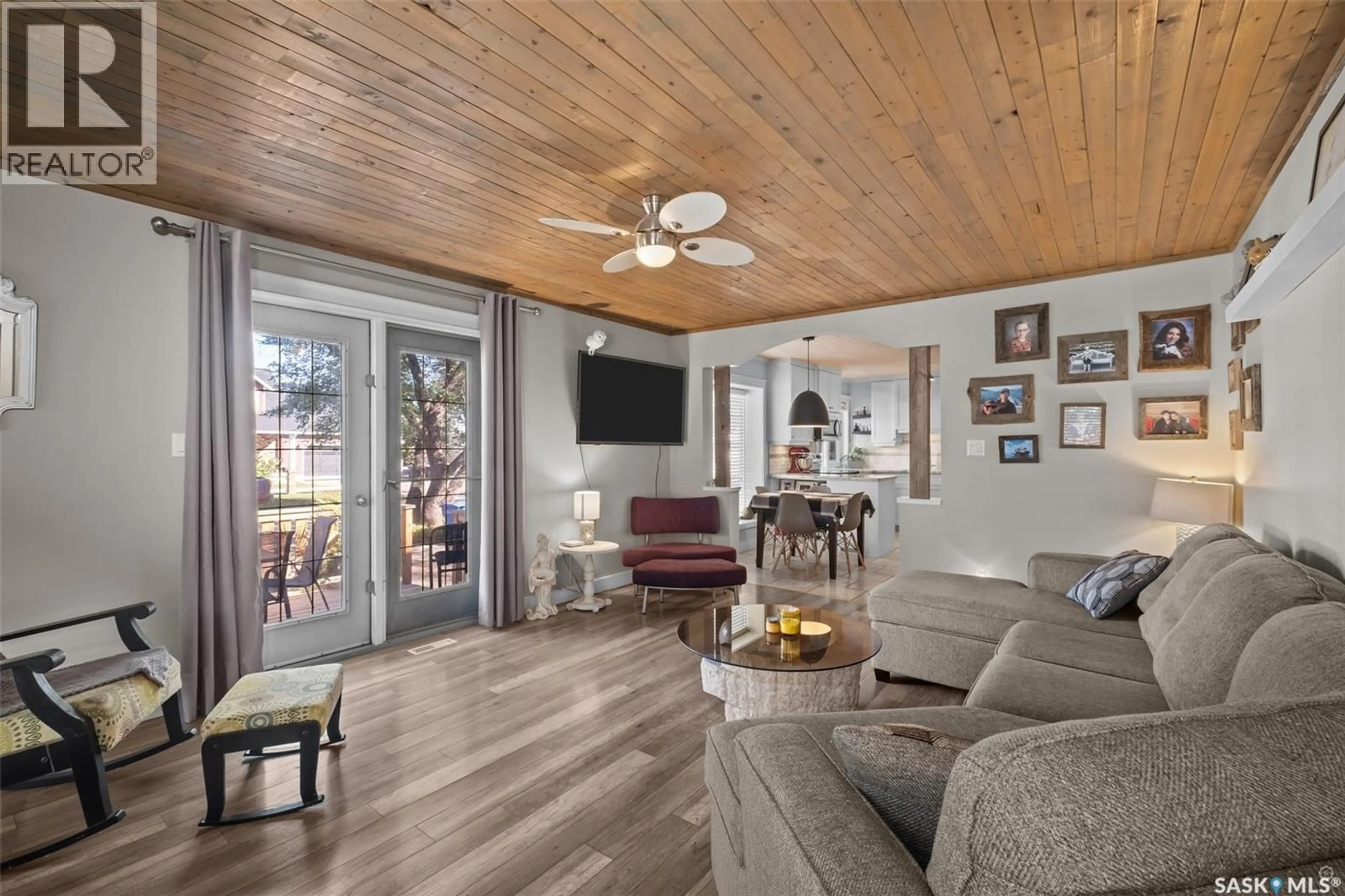 Living room with furniture, wood/laminate floor for 1055 6TH STREET, Prince Albert Saskatchewan S6V0P6