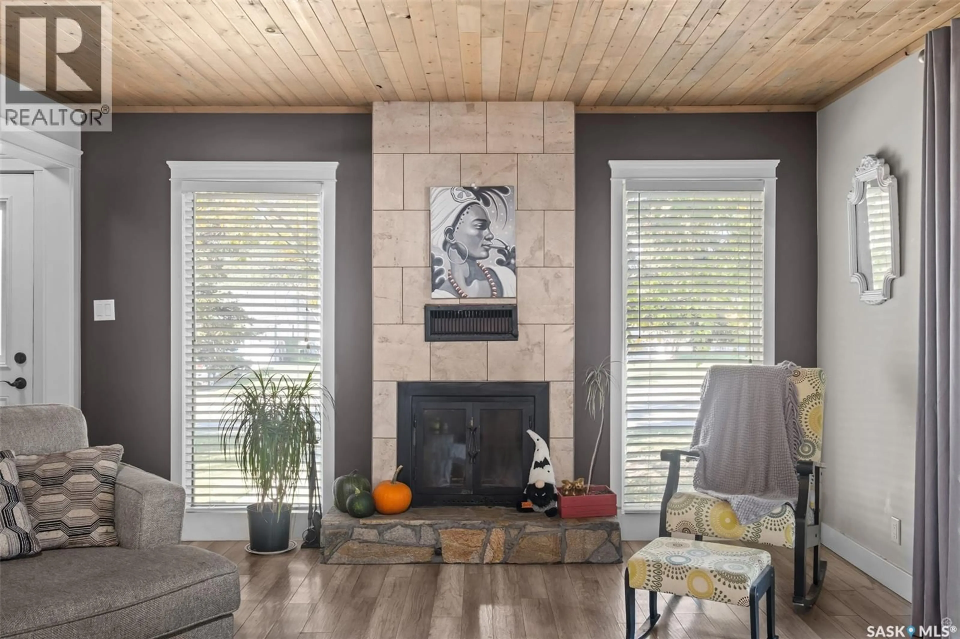Living room with furniture, wood/laminate floor for 1055 6TH STREET, Prince Albert Saskatchewan S6V0P6