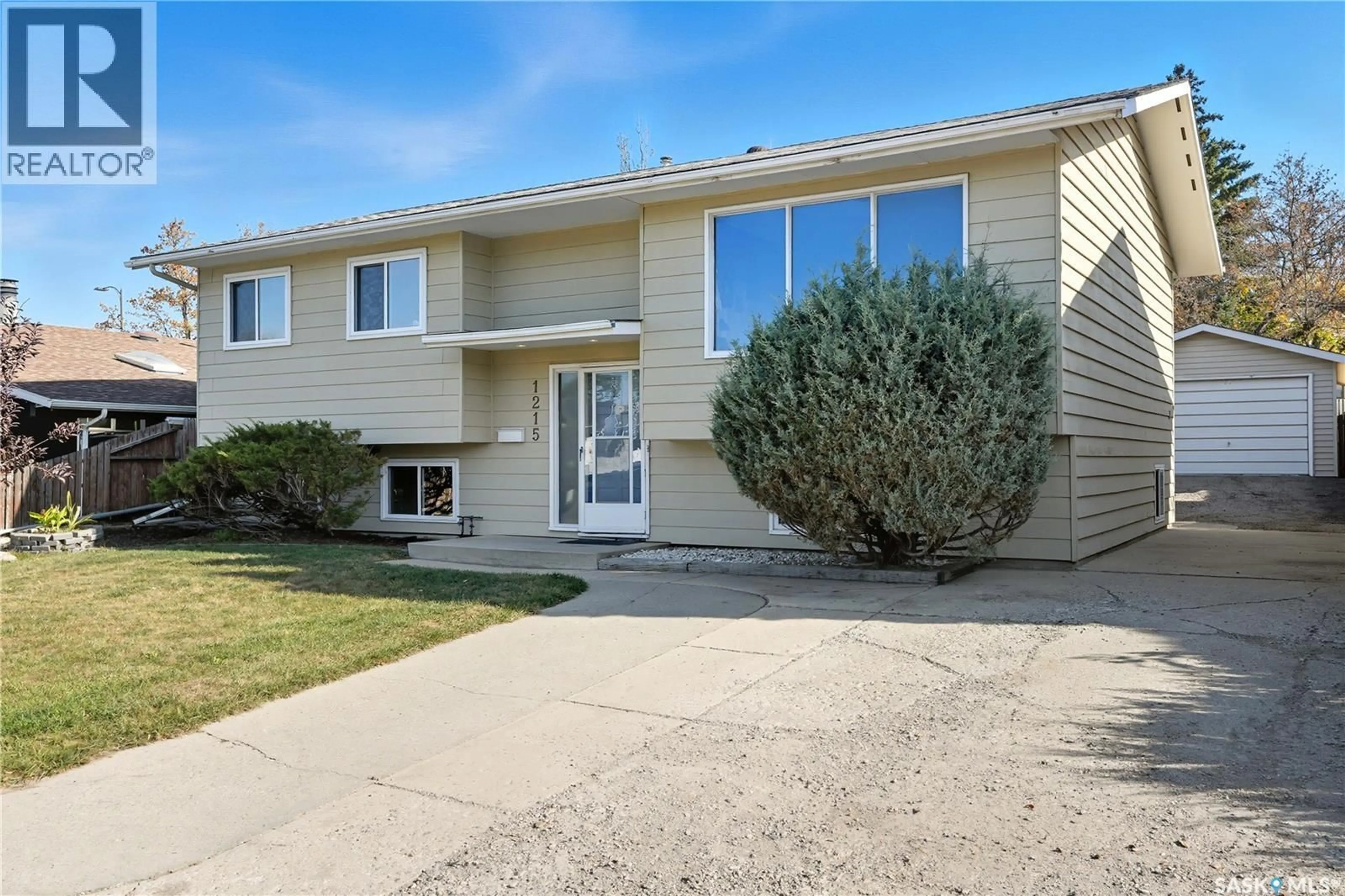 Home with vinyl exterior material, street for 1215 ACADIA DRIVE, Saskatoon Saskatchewan S7H4X4