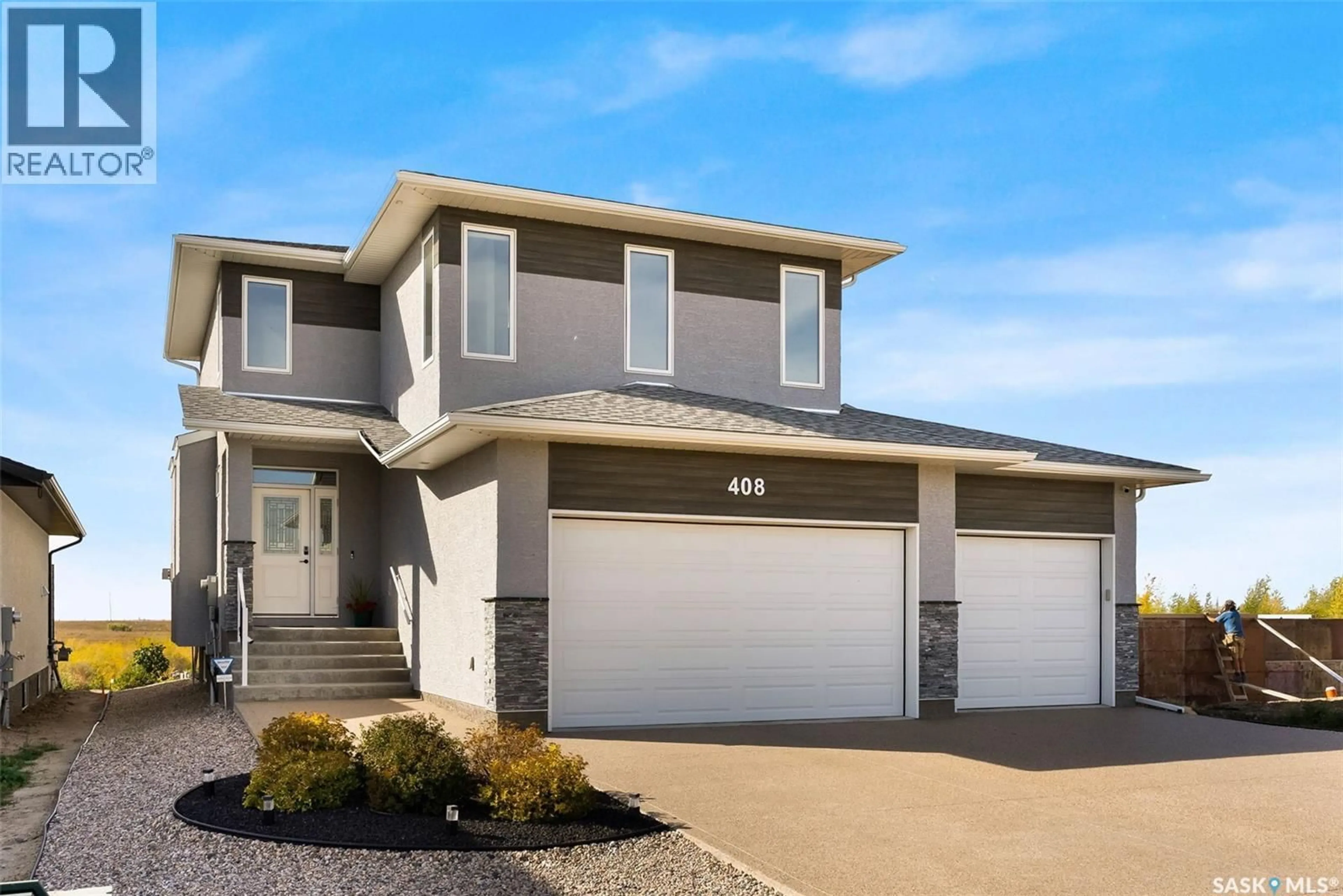 Home with vinyl exterior material, street for 408 HILLSIDE DRIVE, Pilot Butte Saskatchewan S0G3Z0