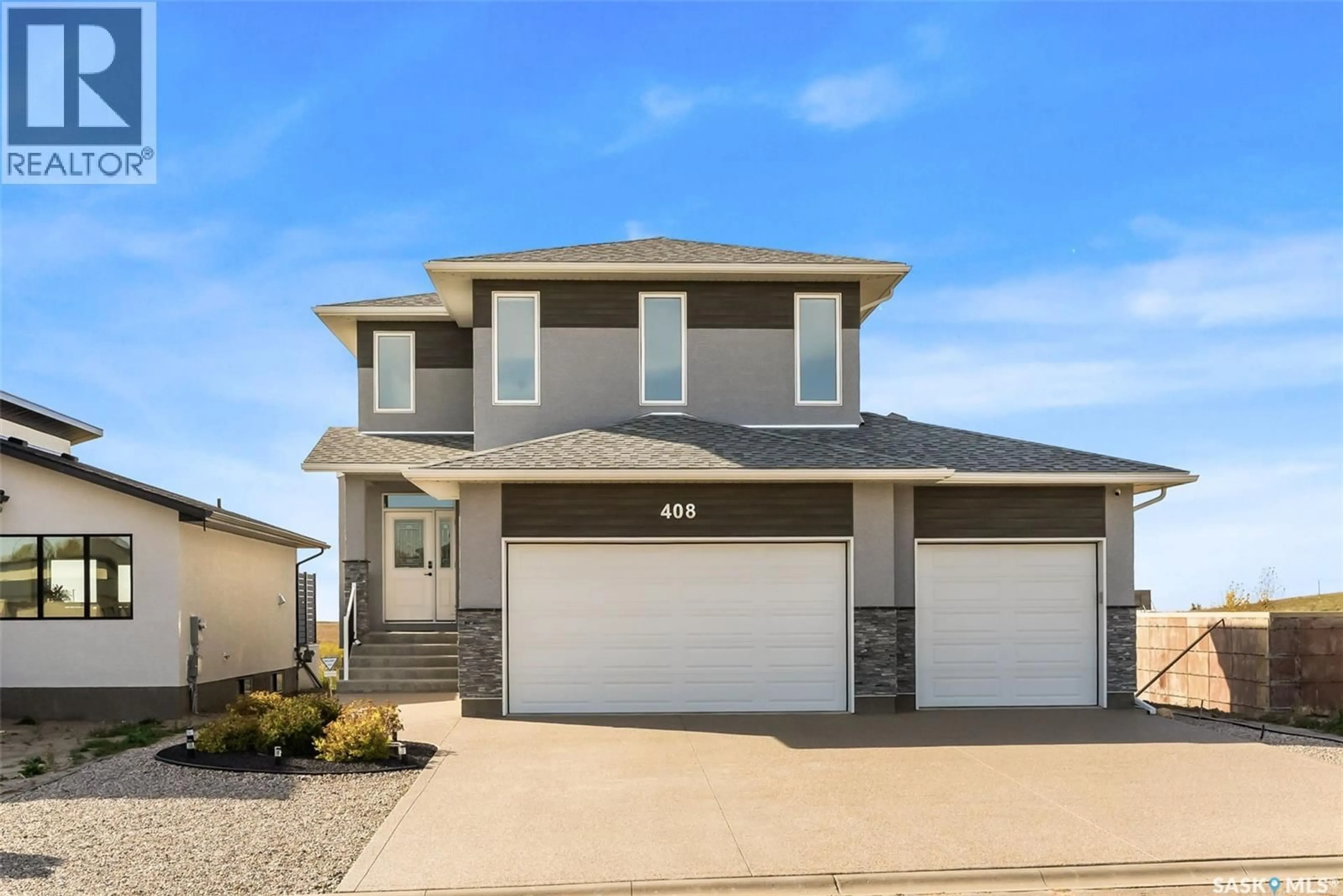 Home with vinyl exterior material, street for 408 HILLSIDE DRIVE, Pilot Butte Saskatchewan S0G3Z0