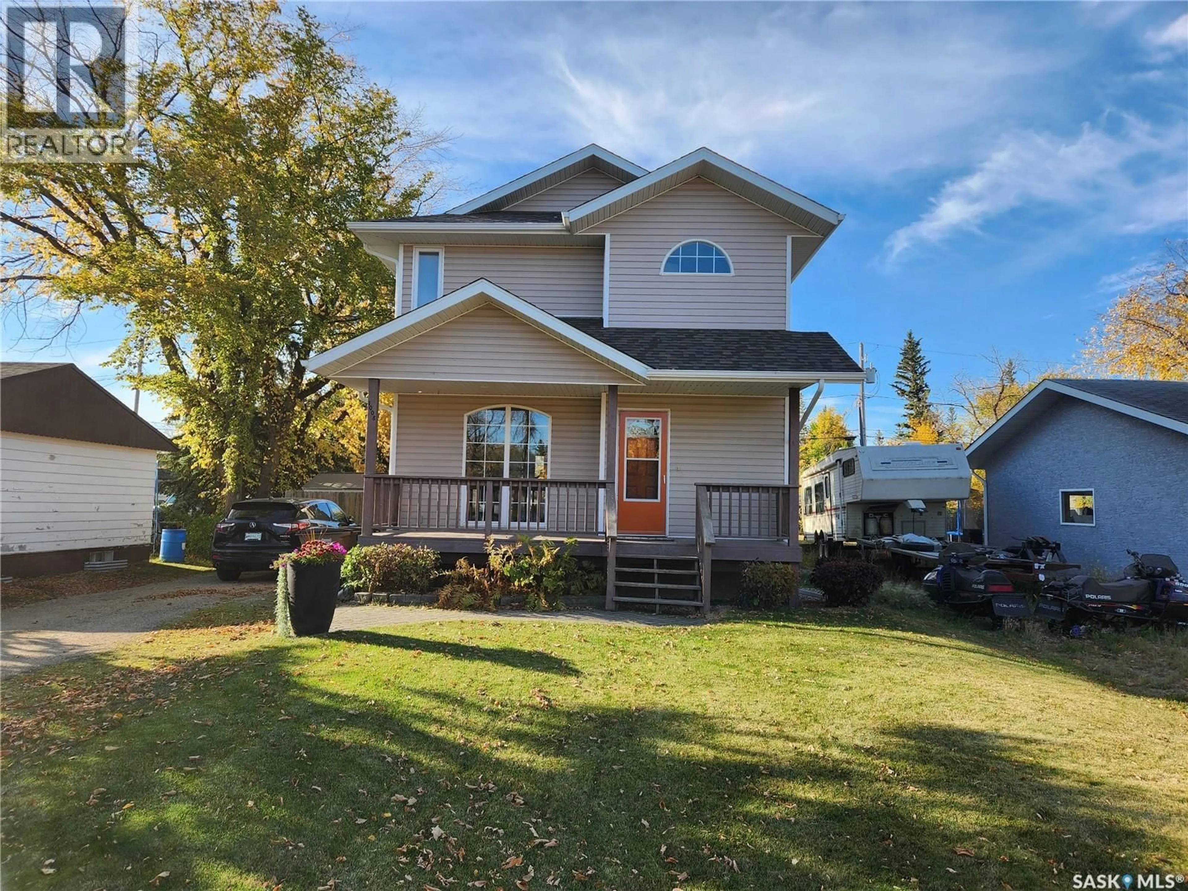 Home with vinyl exterior material, street for 1008 108TH AVENUE, Tisdale Saskatchewan S0E1T0