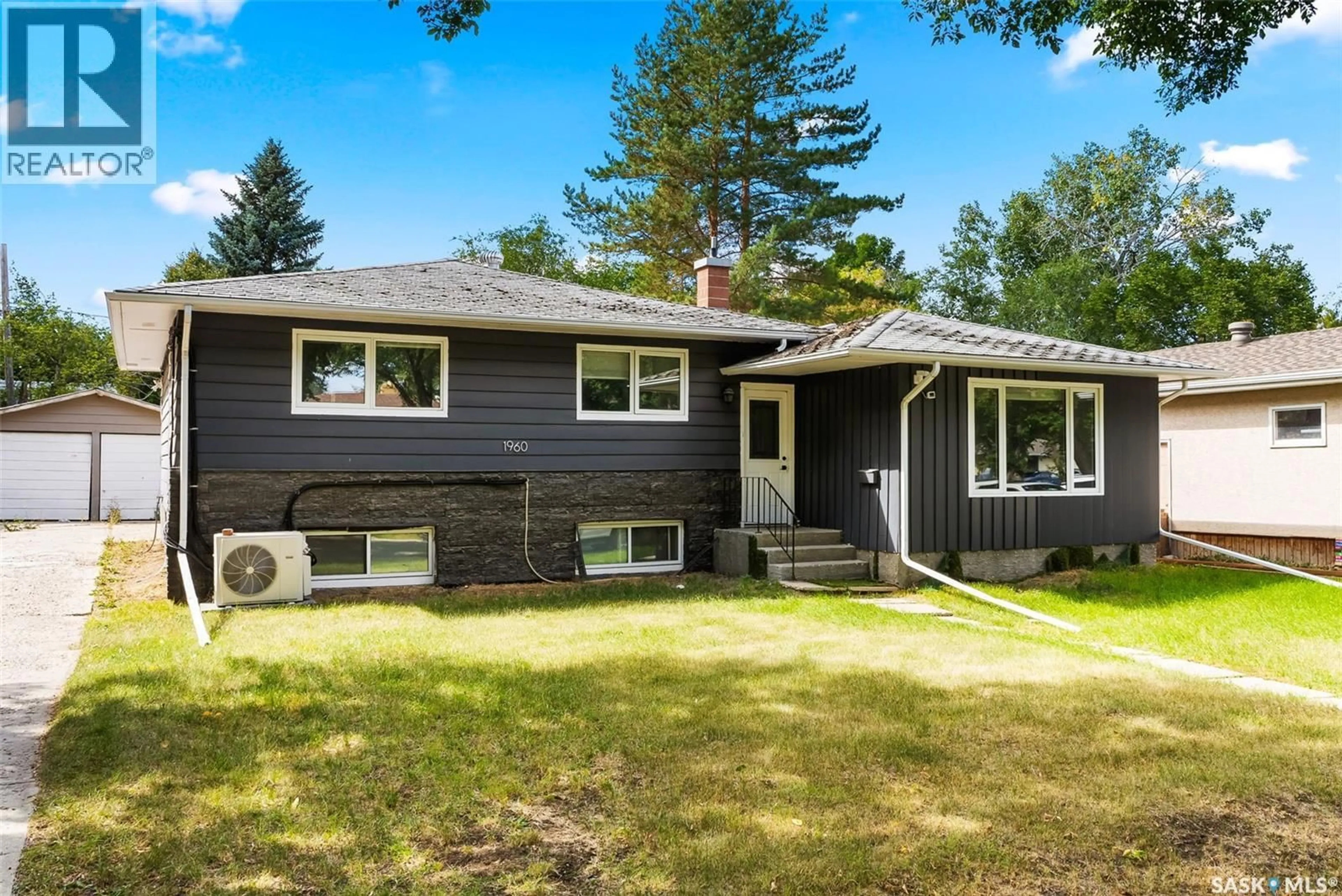 Home with vinyl exterior material, street for 1960 COWAN CRESCENT, Regina Saskatchewan S4S4C6