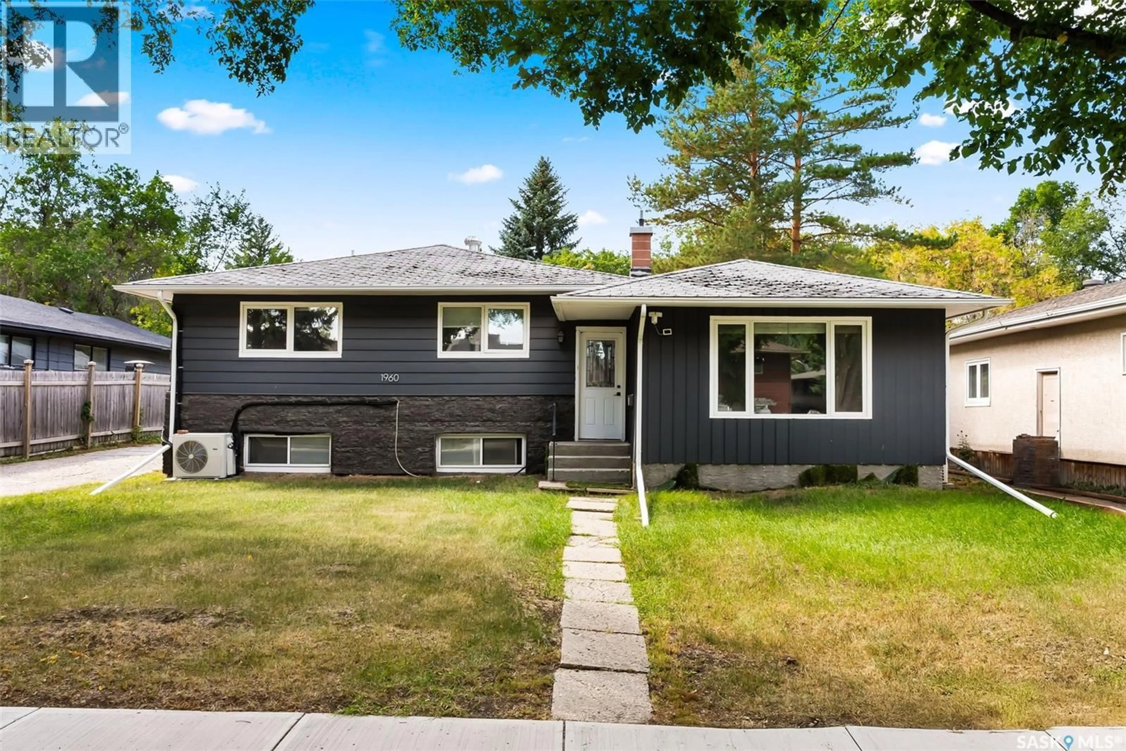 Home with vinyl exterior material, street for 1960 COWAN CRESCENT, Regina Saskatchewan S4S4C6