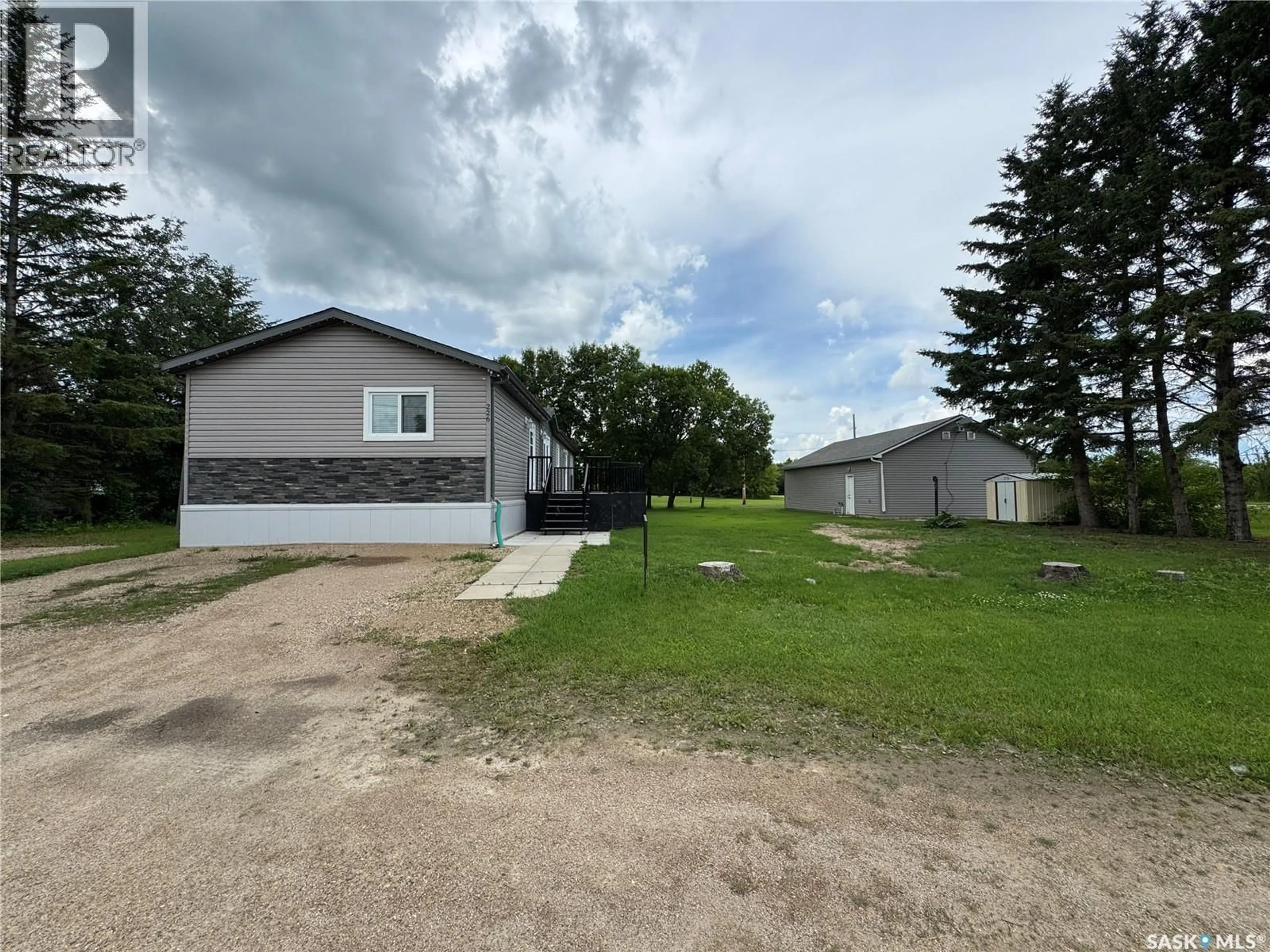 A pic from outside/outdoor area/front of a property/back of a property/a pic from drone, building for 226 HOPP STREET, Jansen Saskatchewan S0K2B0