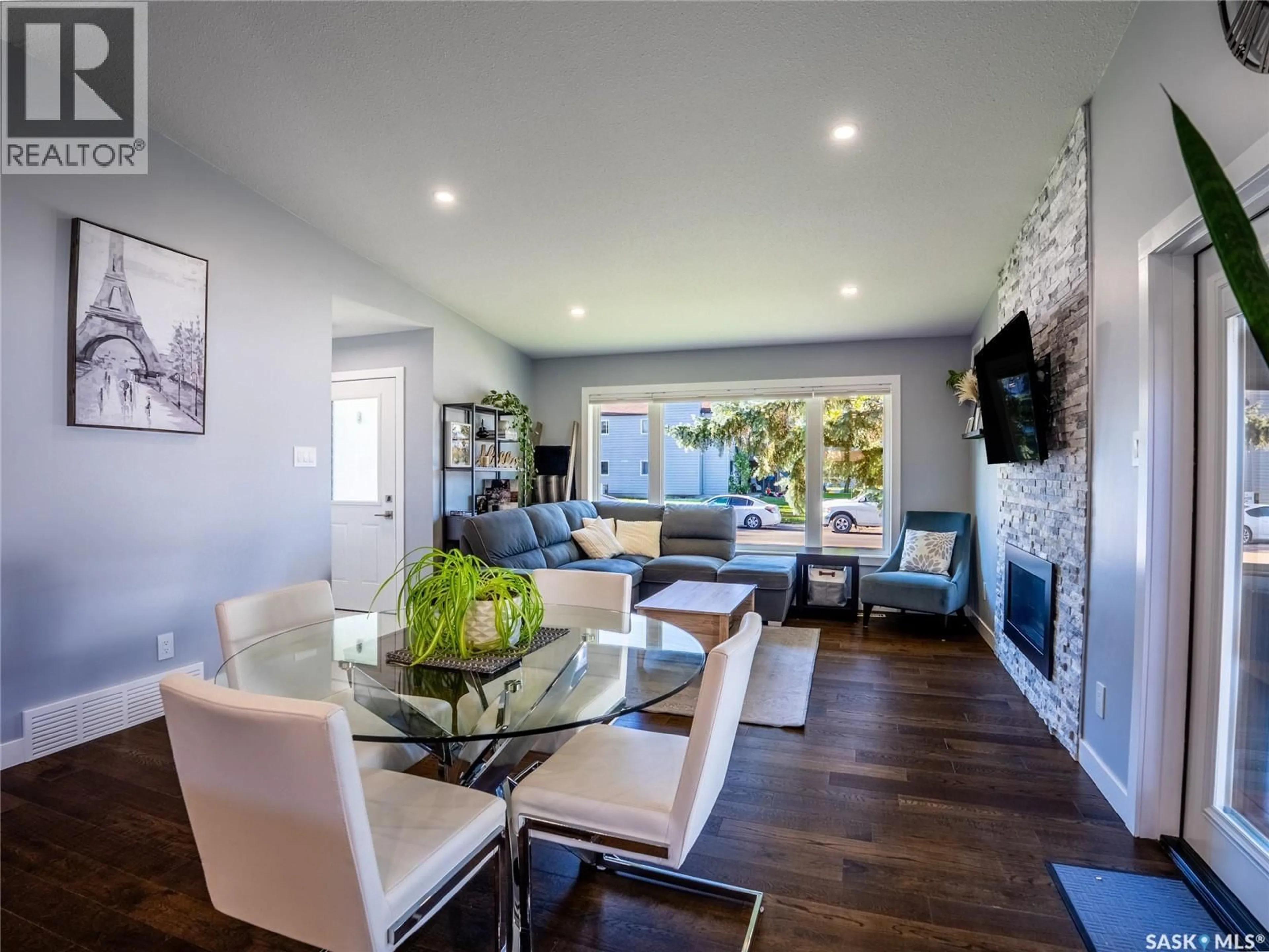 Living room with furniture, wood/laminate floor for 3123 EDINBURGH DRIVE, Regina Saskatchewan S4V1H5