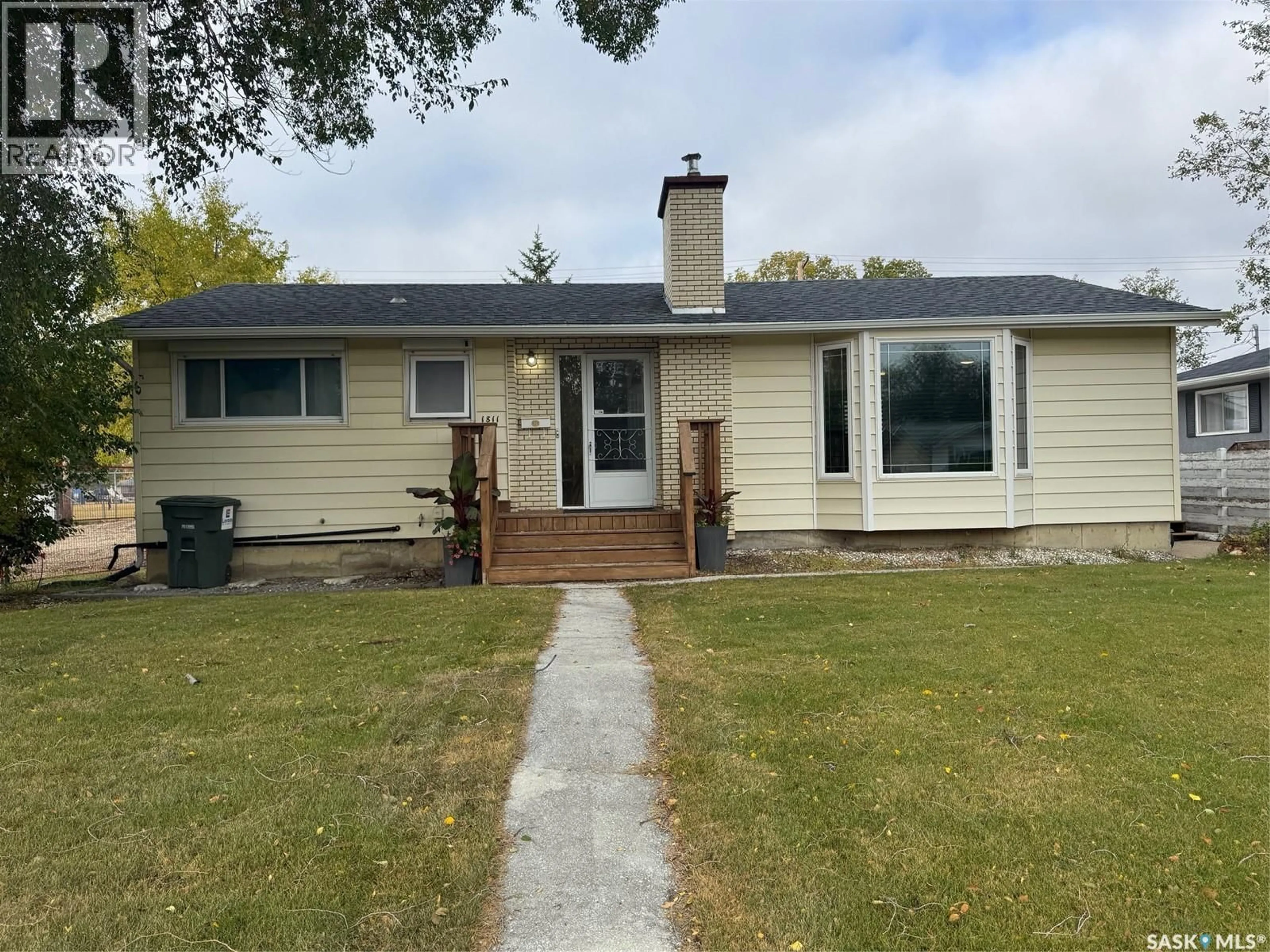 Home with vinyl exterior material, street for 1811 91ST STREET, North Battleford Saskatchewan S9A0A6