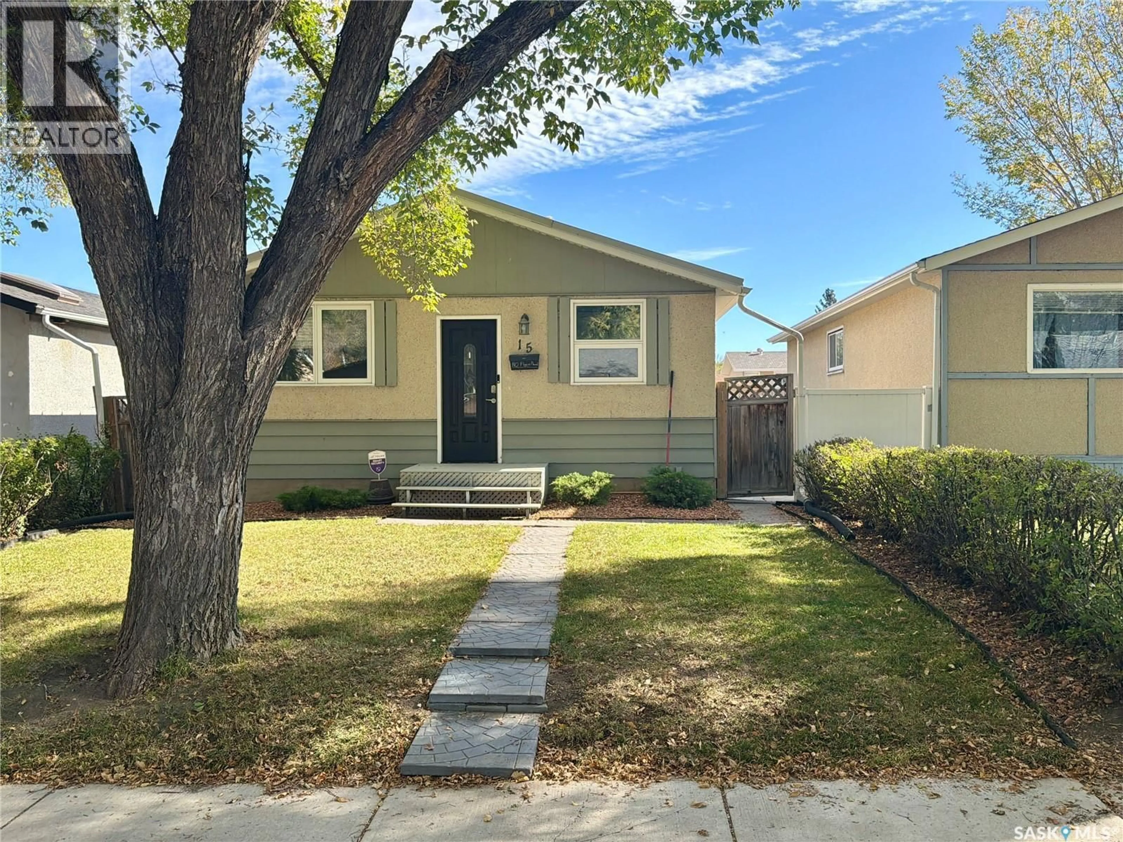 Home with vinyl exterior material, street for 15 MARSHALL CRESCENT, Regina Saskatchewan S4R4Y8
