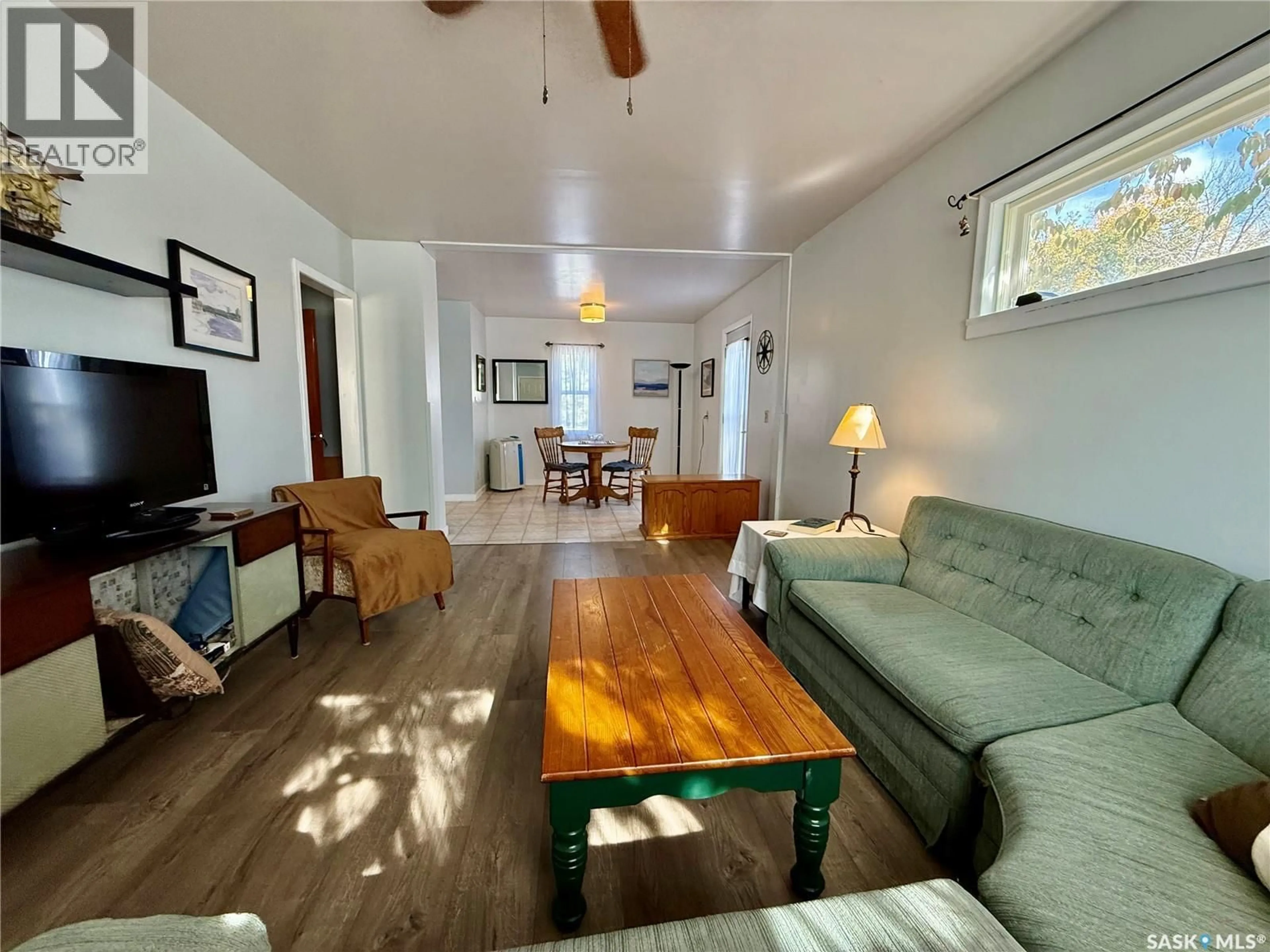 Living room with furniture, wood/laminate floor for 127 DARLINGTON AVENUE, Yorkton Saskatchewan S3N0C8