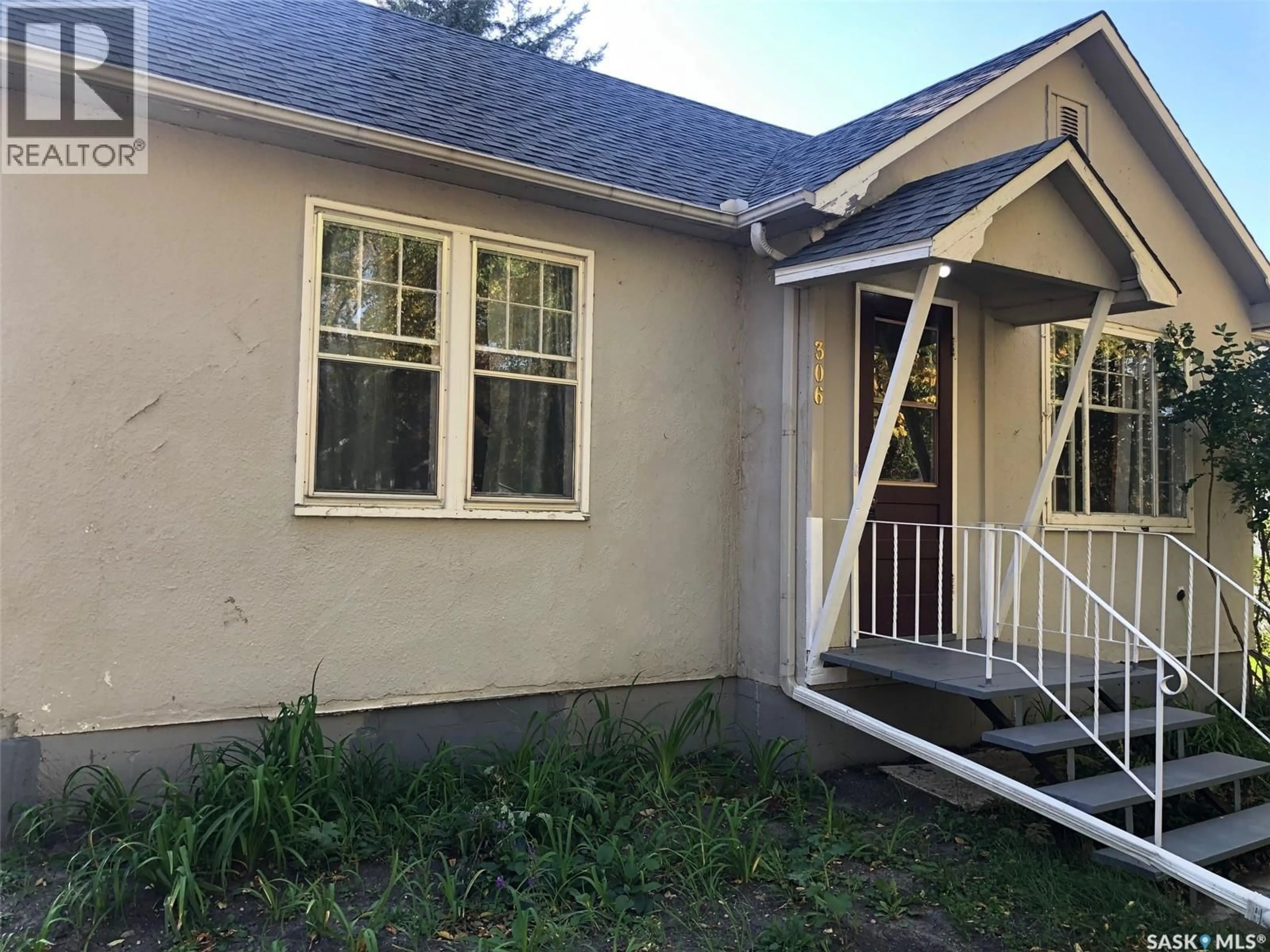 Home with vinyl exterior material, street for 306 COTTER STREET, Kamsack Saskatchewan S0A1S0