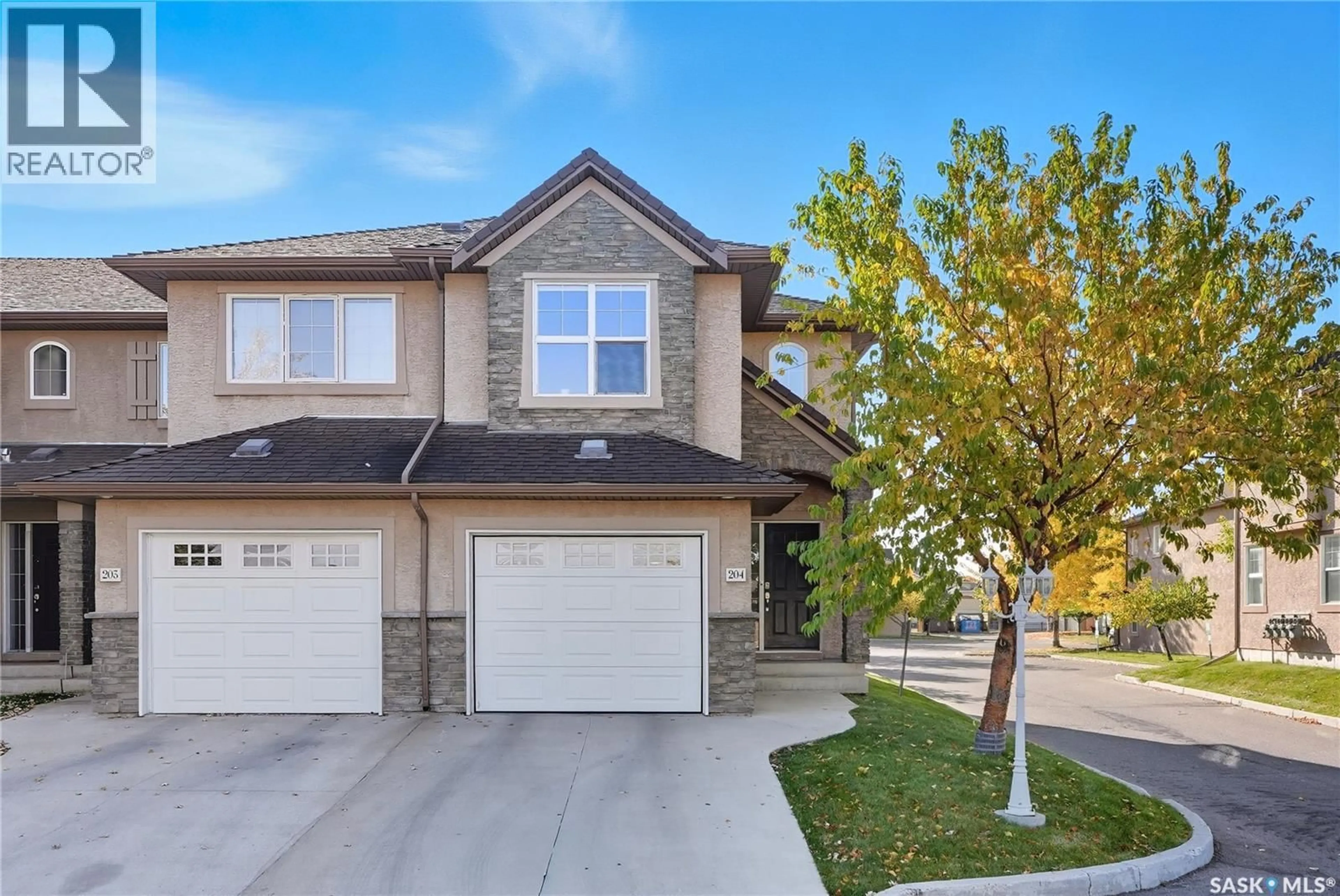 Home with vinyl exterior material, street for 204 - 710 GORDON ROAD, Saskatoon Saskatchewan S7T0J5