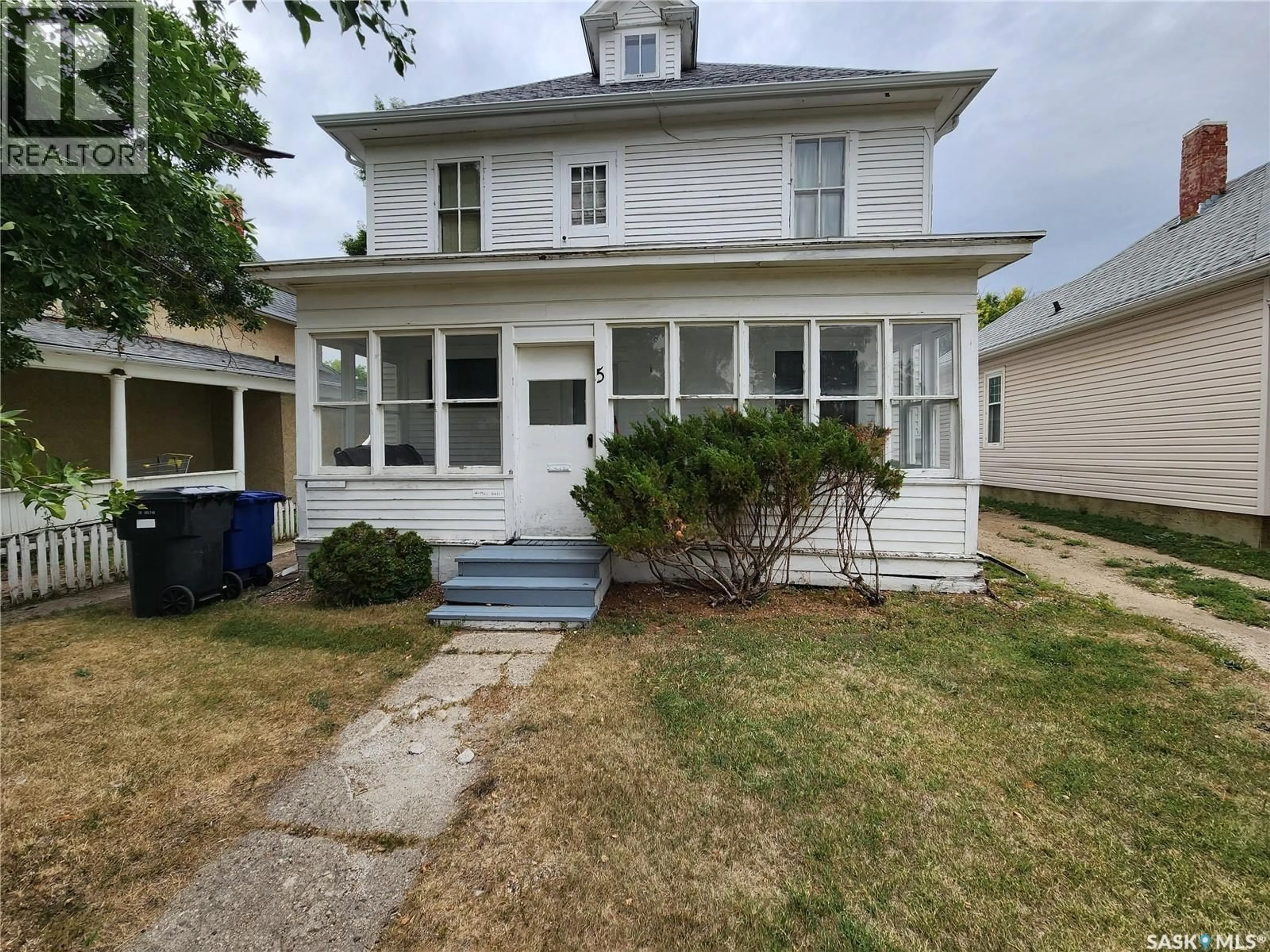 Home with vinyl exterior material, street for 5 PRAIRIE AVENUE, Weyburn Saskatchewan S4H0K9