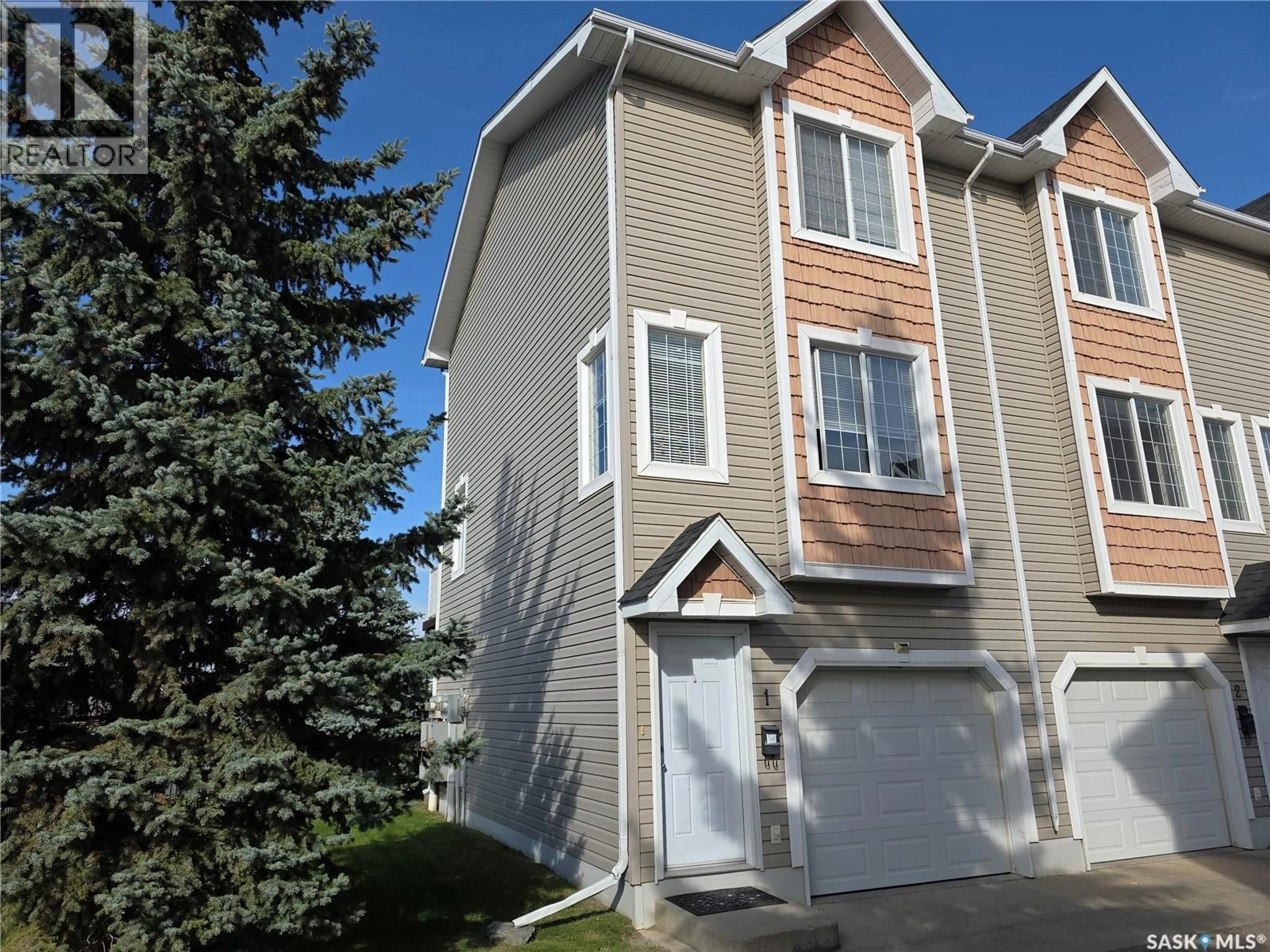 Home with vinyl exterior material, street for 1 302 HEROLD ROAD, Saskatoon Saskatchewan S7V1J3