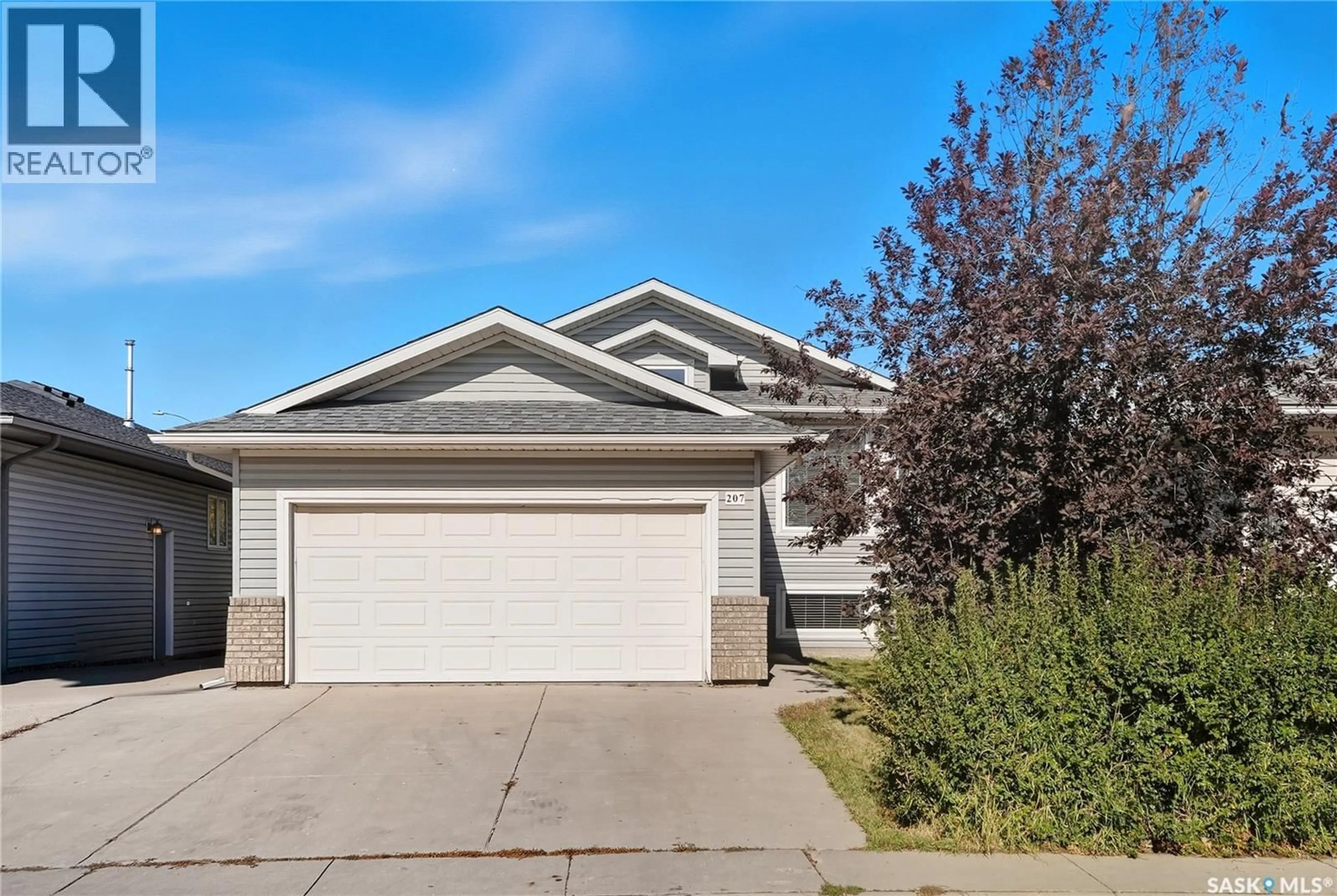 Home with vinyl exterior material, street for 207 BUCKWOLD COVE, Saskatoon Saskatchewan S7N4V8