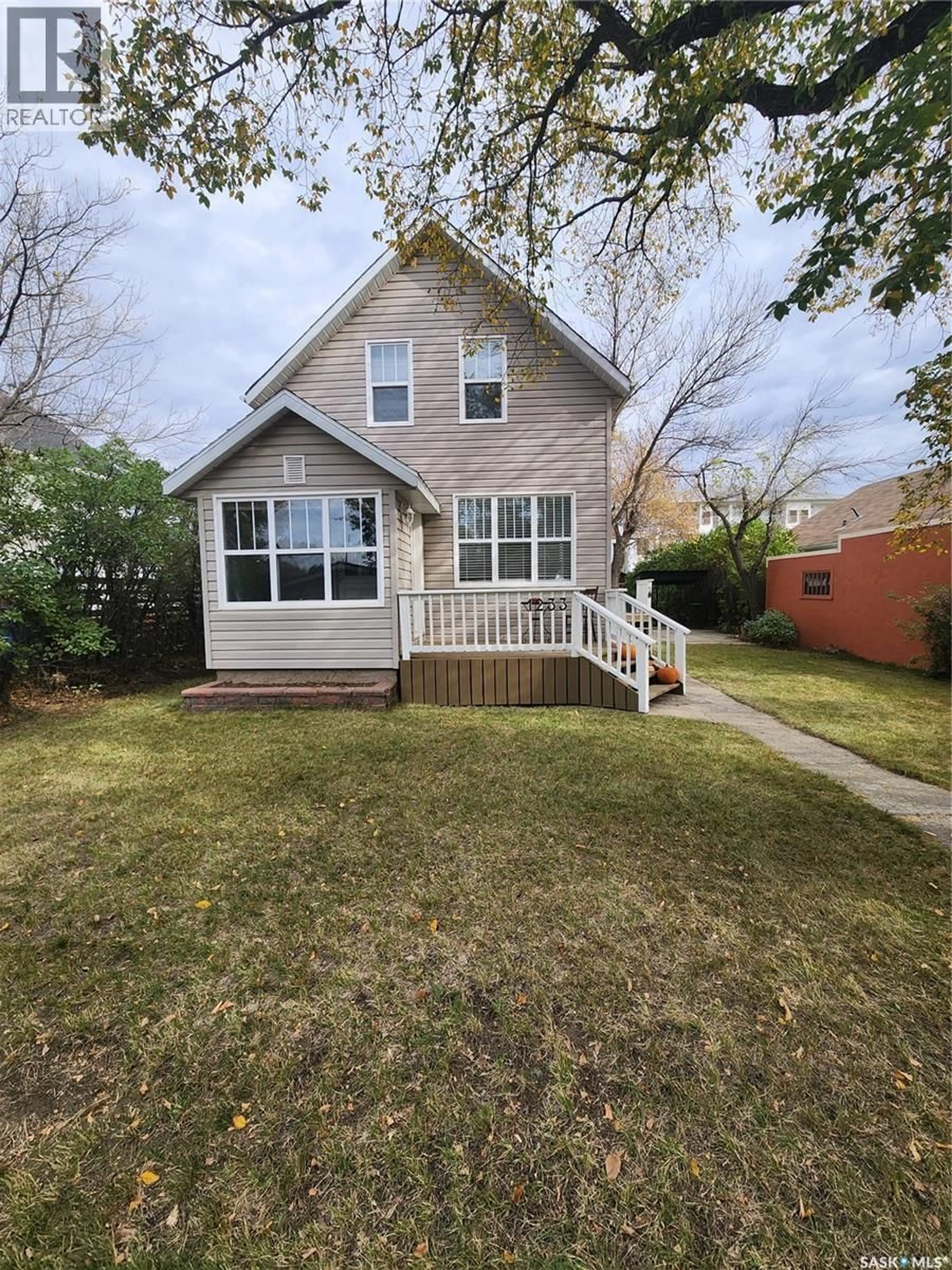 Home with vinyl exterior material, street for 1233 2ND STREET, Estevan Saskatchewan S4A0M1