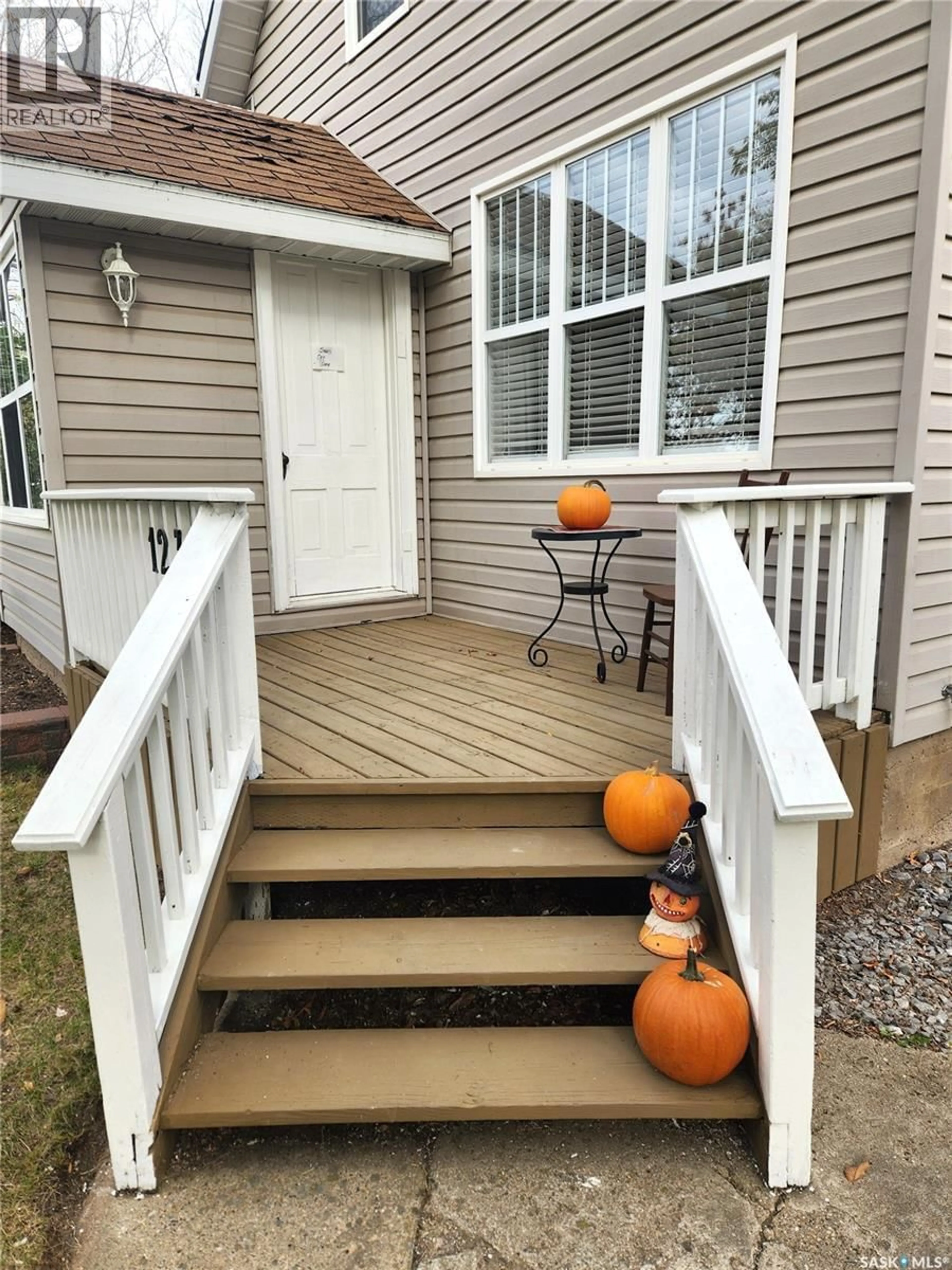 Home with vinyl exterior material, street for 1233 2ND STREET, Estevan Saskatchewan S4A0M1