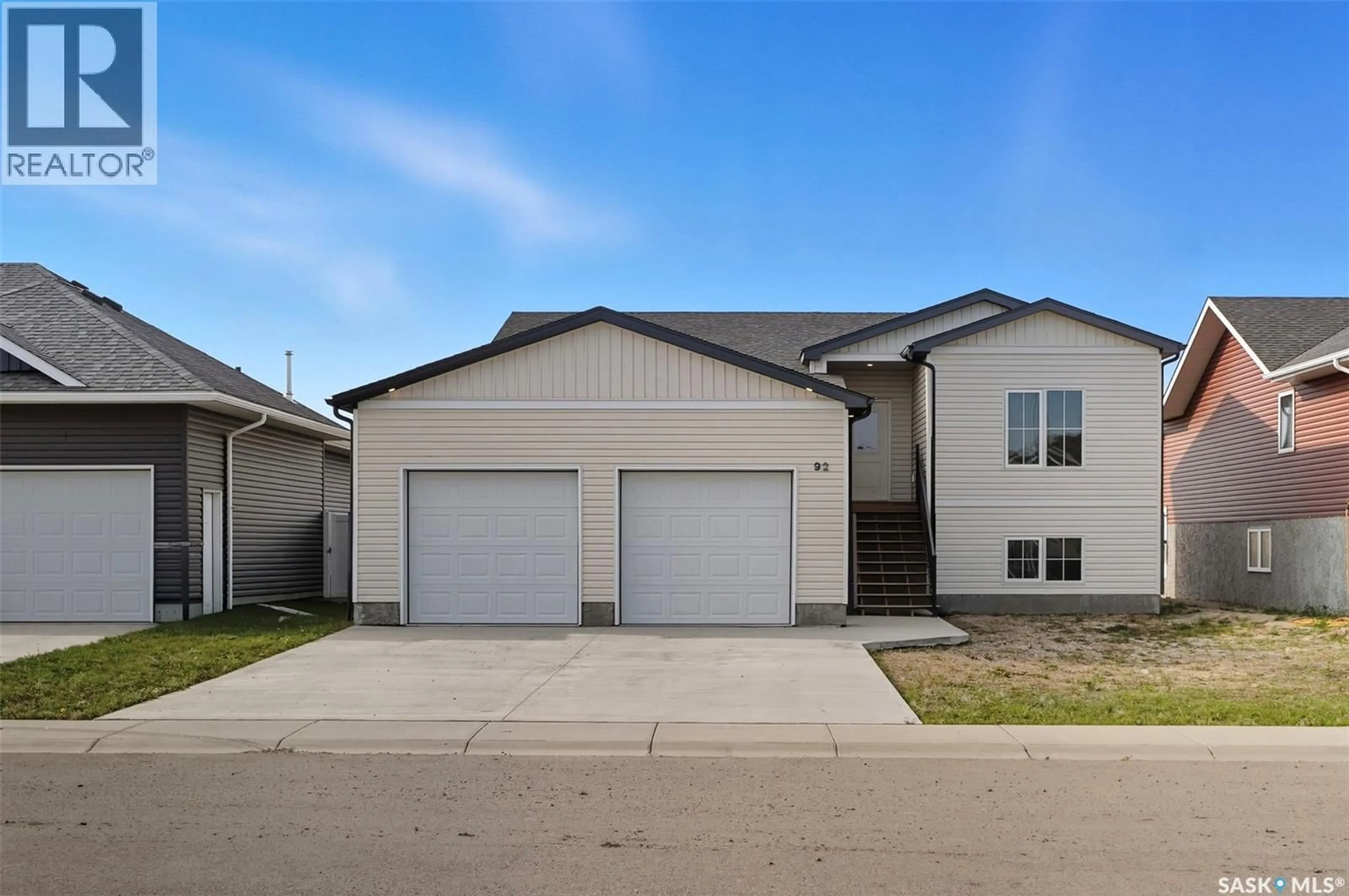 Home with vinyl exterior material, street for 92 DIEFENBAKER AVENUE, Hague Saskatchewan S0K1X0