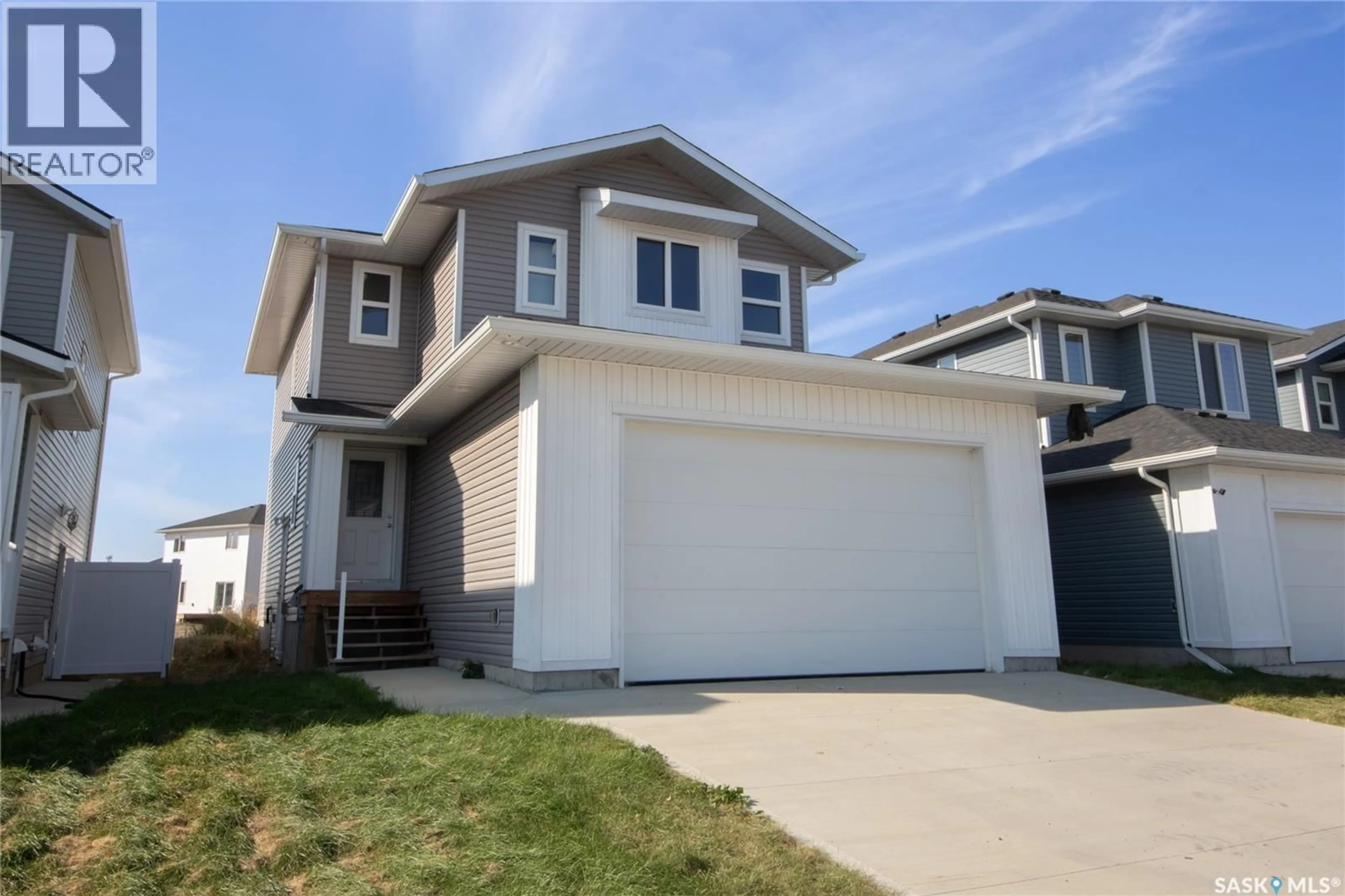 Home with vinyl exterior material, street for 111 STROMBERG CRESCENT, Saskatoon Saskatchewan S7L7C4
