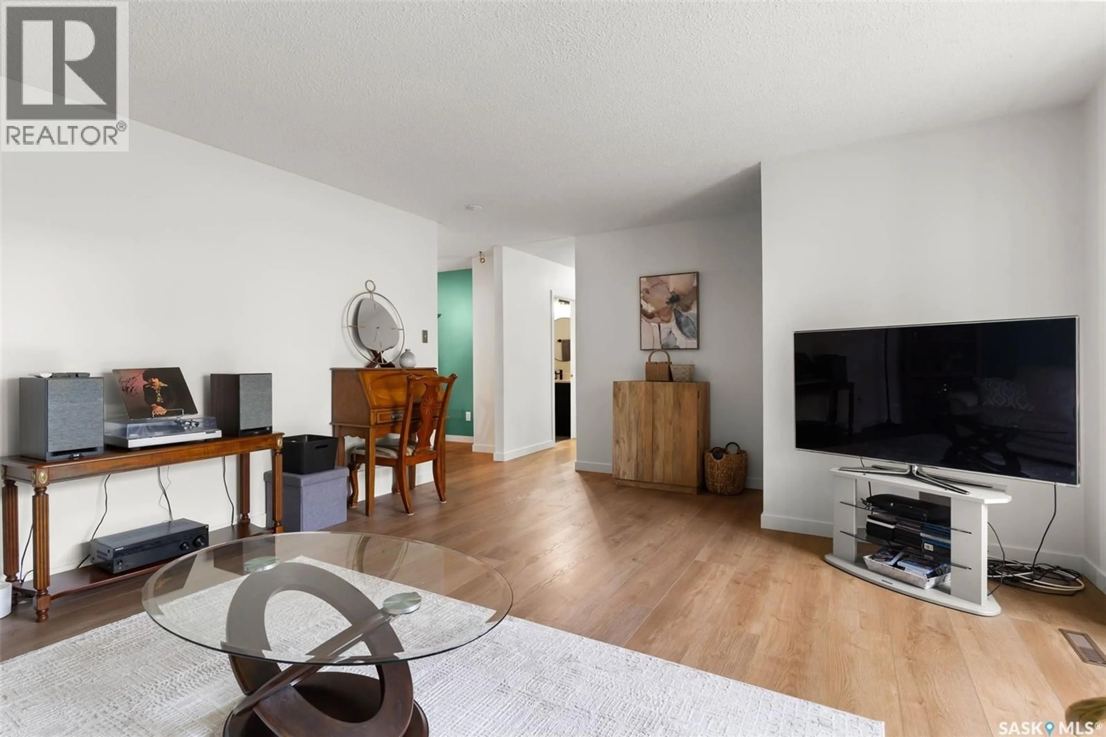 Living room with furniture, wood/laminate floor for 7 NORRIS ROAD, Regina Saskatchewan S4S5N1