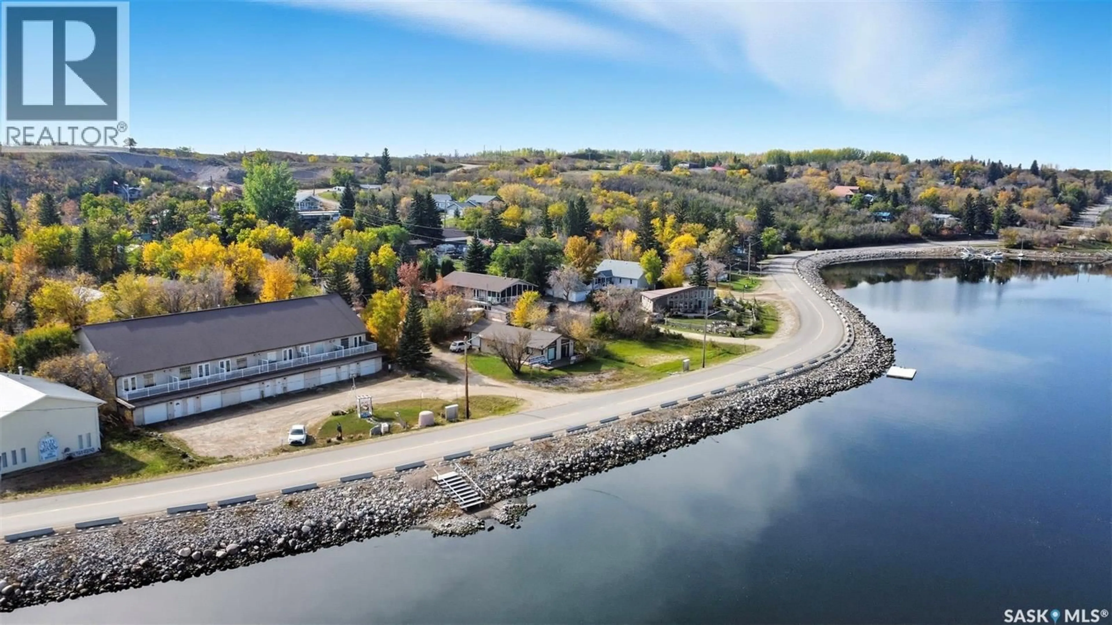A pic from outside/outdoor area/front of a property/back of a property/a pic from drone, water/lake/river/ocean view for 5 412 LAKE AVENUE, Manitou Beach Saskatchewan S0K4T1
