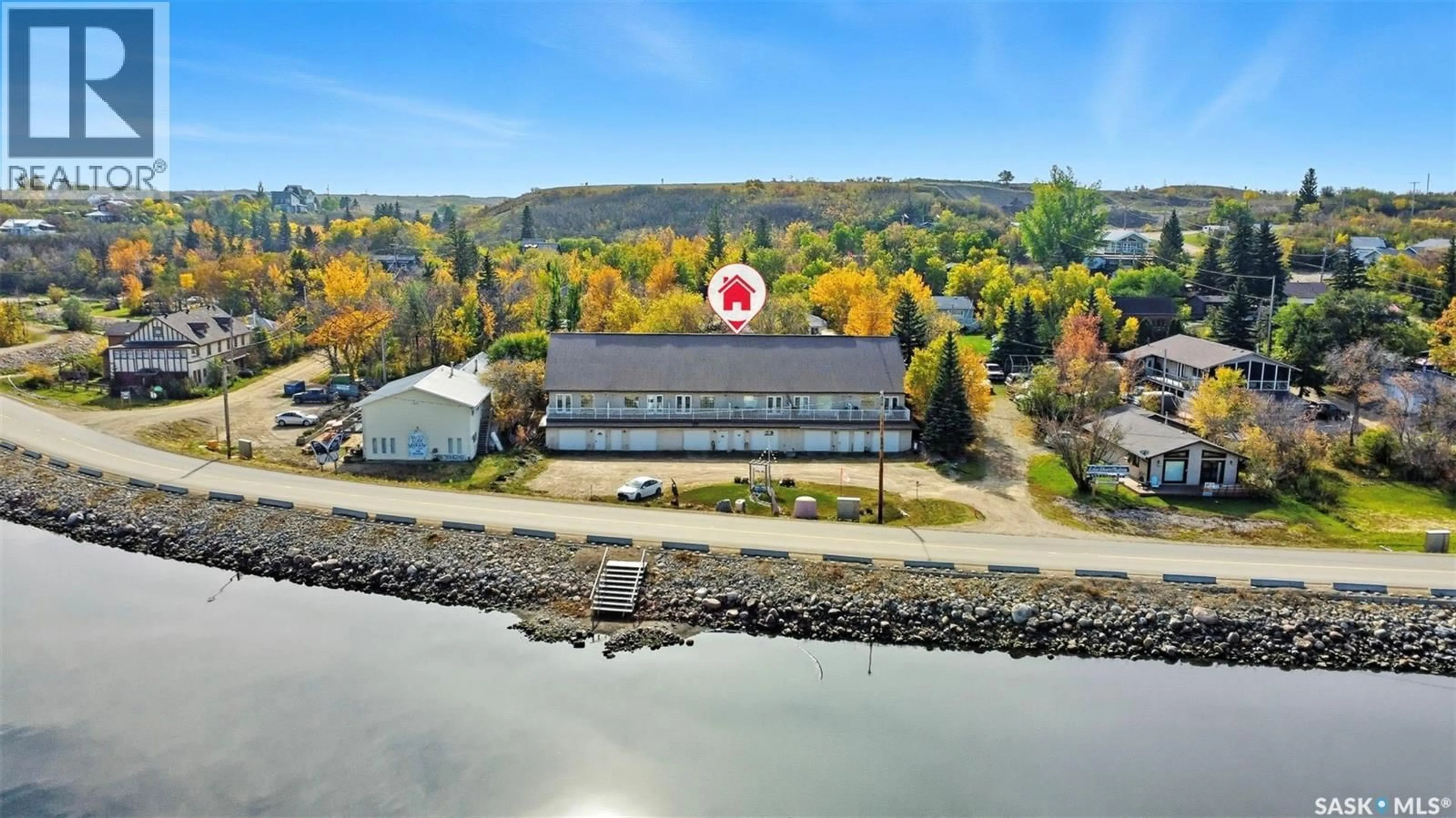 A pic from outside/outdoor area/front of a property/back of a property/a pic from drone, water/lake/river/ocean view for 5 412 LAKE AVENUE, Manitou Beach Saskatchewan S0K4T1