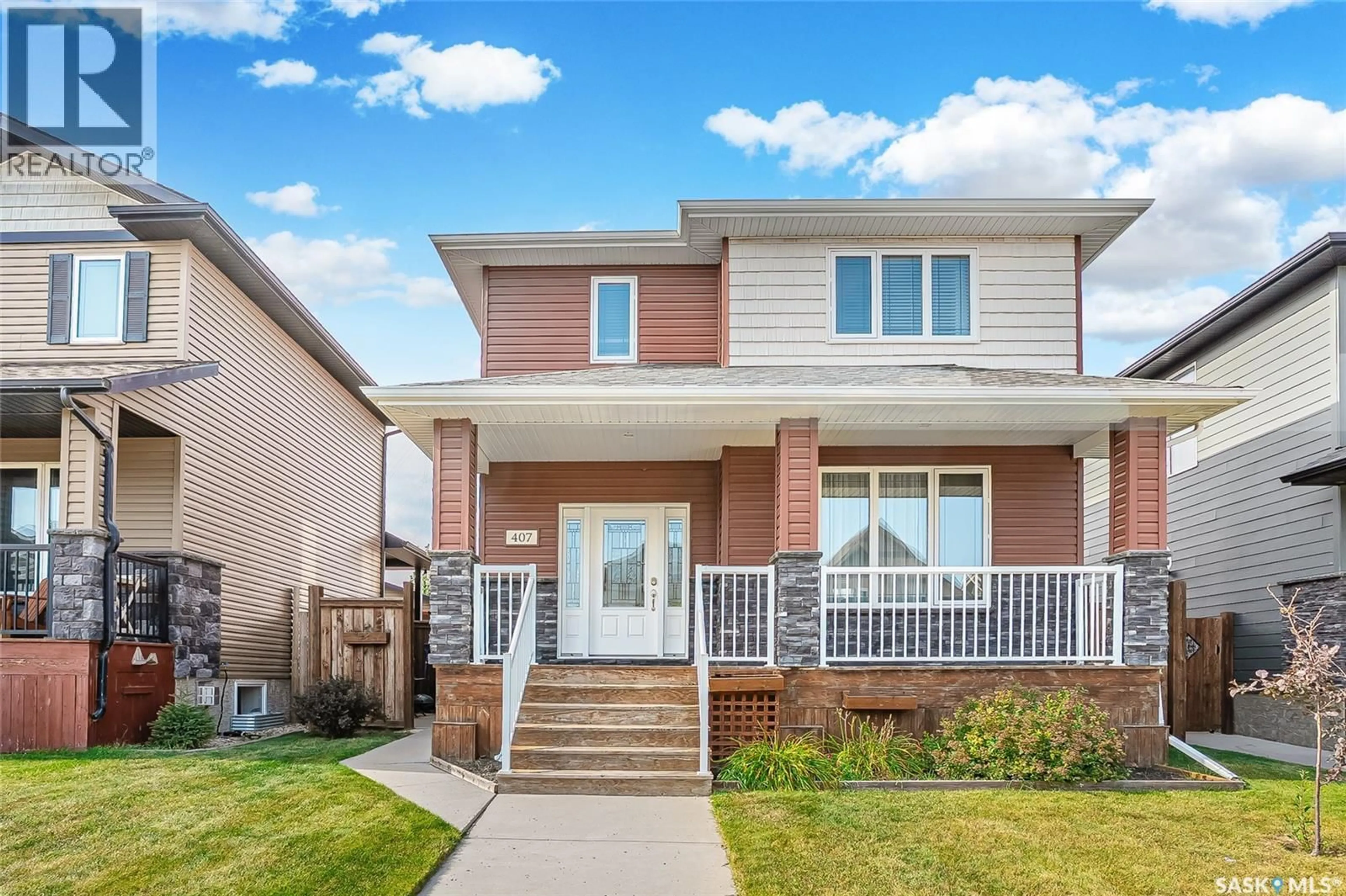 Home with vinyl exterior material, street for 407 GOLDEN WILLOW WAY, Warman Saskatchewan S0K4S2