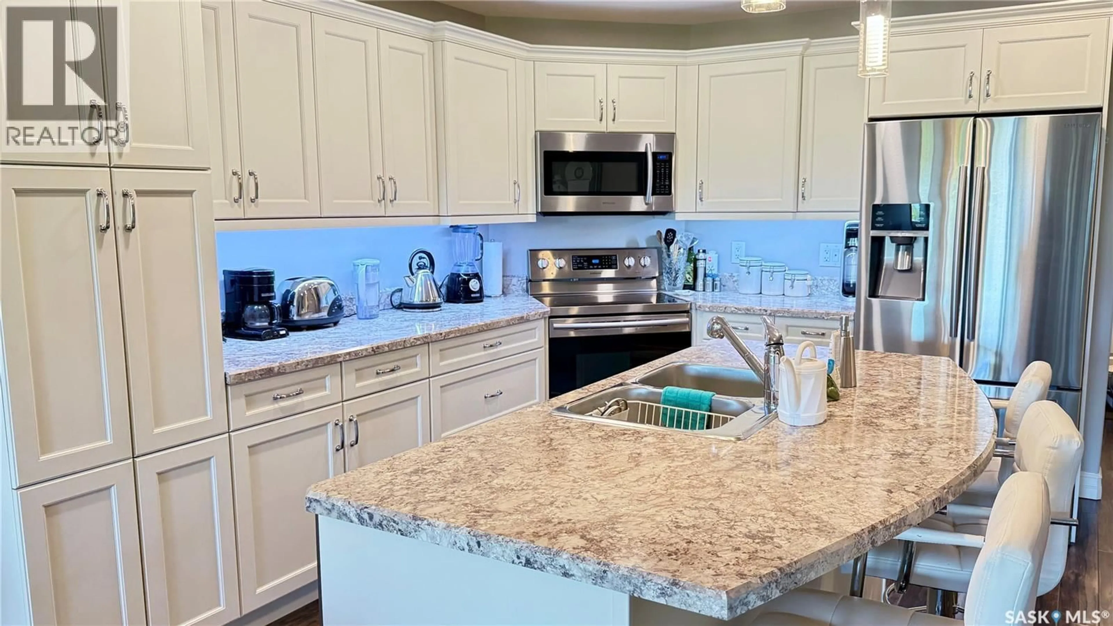 Open concept kitchen, ceramic/tile floor for 202 1600 1ST STREET E, Prince Albert Saskatchewan S6V1G7