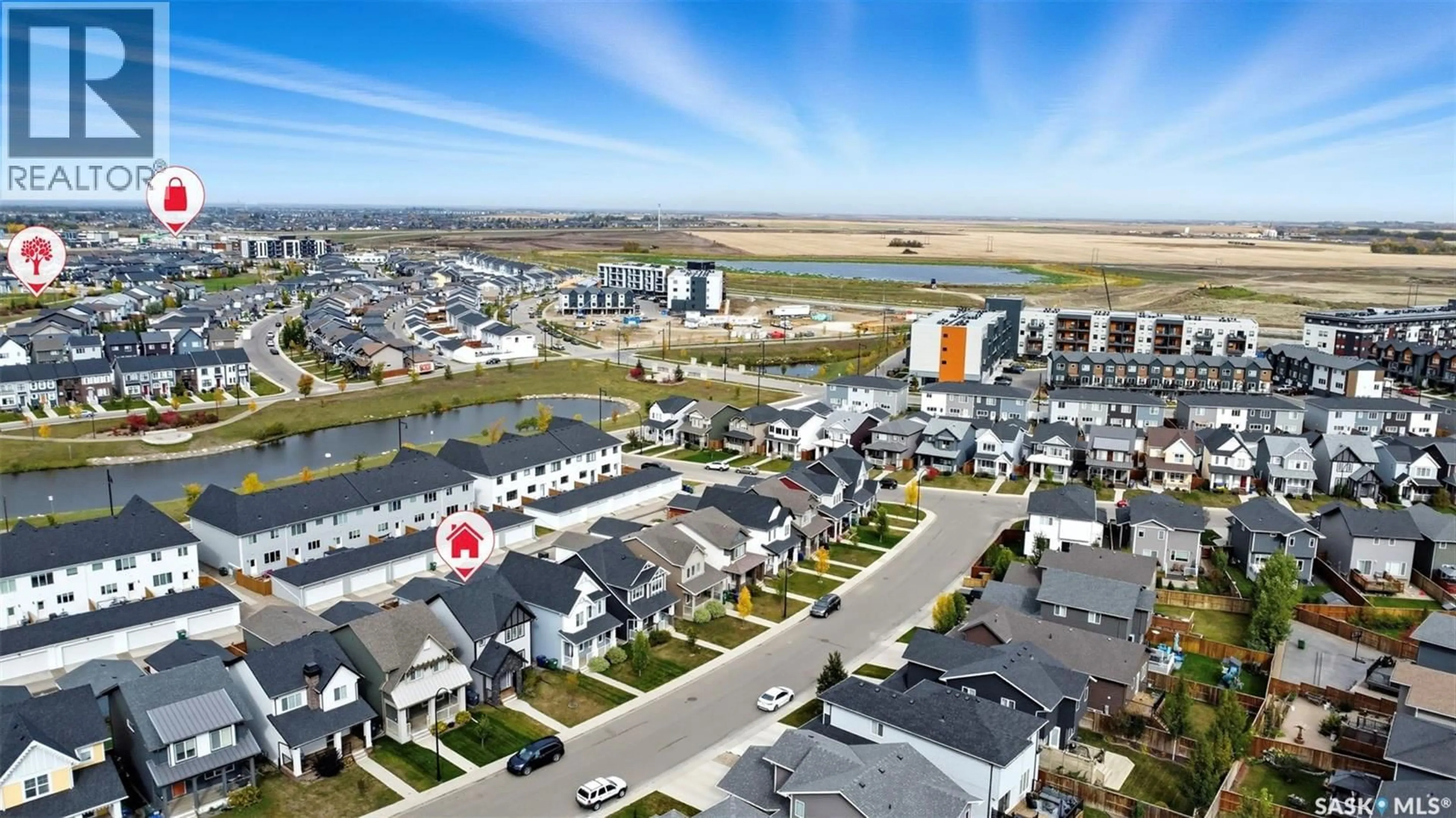 A pic from outside/outdoor area/front of a property/back of a property/a pic from drone, water/lake/river/ocean view for 239 NEWTON LINK, Saskatoon Saskatchewan S7V0N6